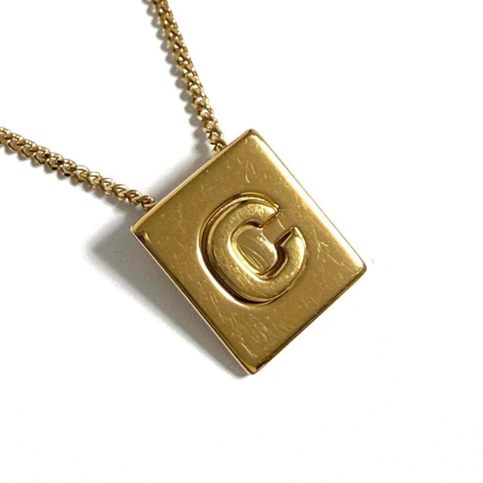 Women's Celine Pendant Necklace Alphabet: Women's Celine Pendant Necklace Alphabet Celine's iconic alphabet pendant necklace, crafted from metal, features a timeless design. Available in women's sizes with adjustable neck circumference (41