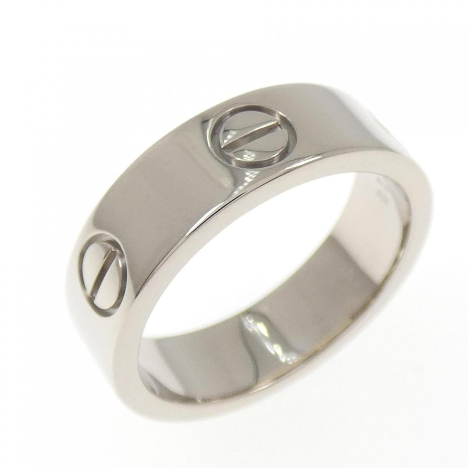 White Gold Cartier Band Ring 18K: White Gold Cartier Band Ring 18K White Gold Cartier Band Ring 18K - A high-end, pre-owned band ring from renowned luxury brand Cartier. Made from 18K white gold, this elegant piece features a classic