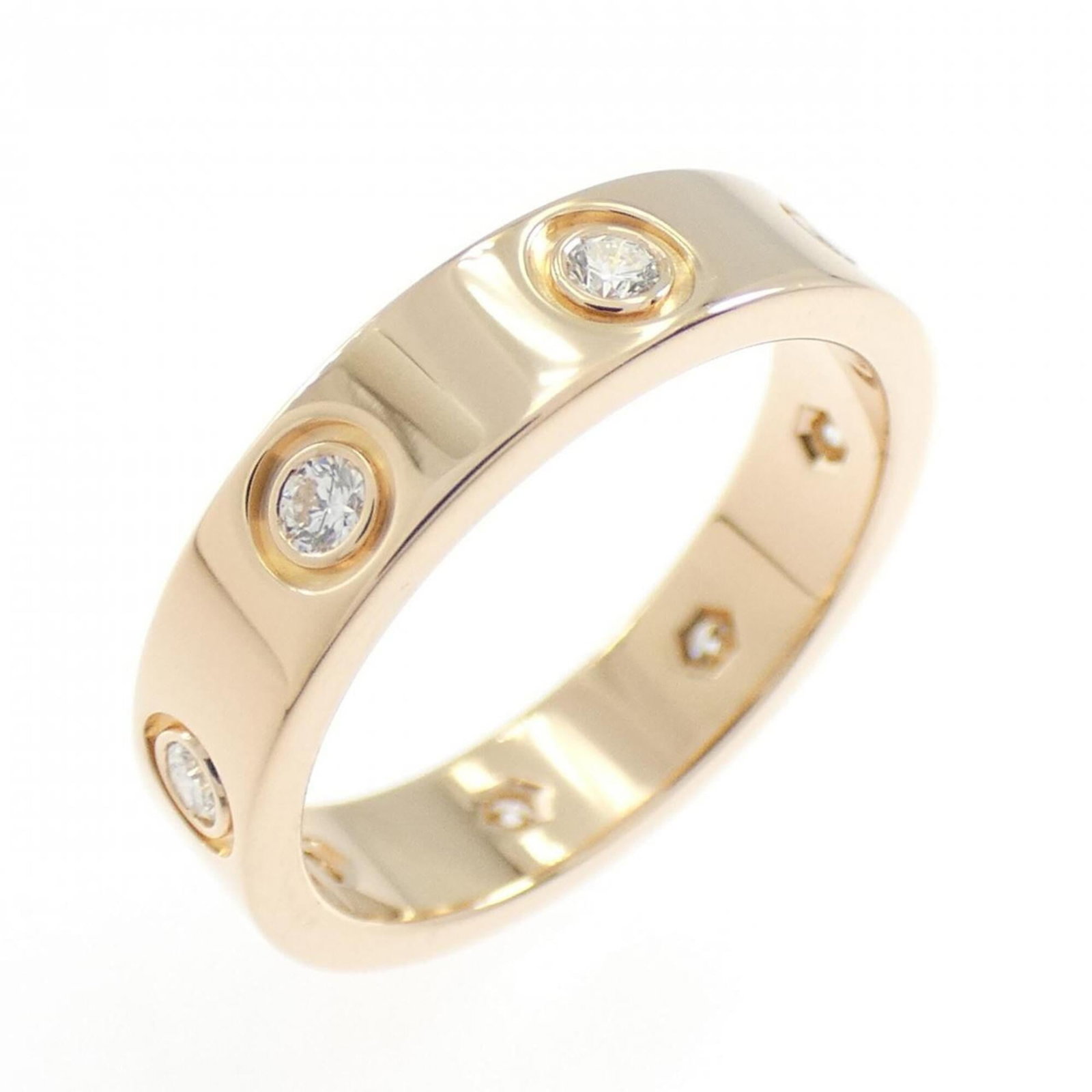 Pink gold 18k ring band from Cartier: Pink gold 18k ring band from Cartier Pink gold 18k Cartier ring band, featuring a diamond stone and measuring 3.8mm in width, offers a touch of elegance to any outfit. This used but very good