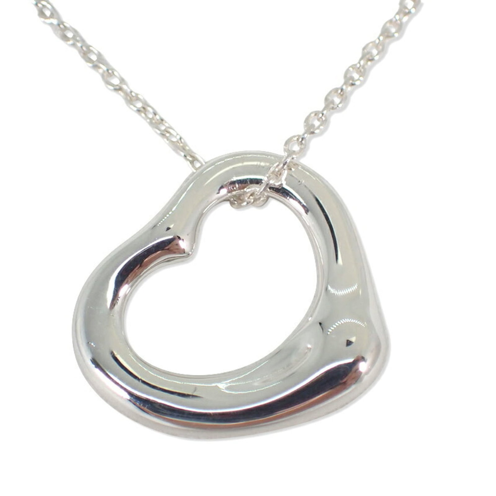 Tiffany 925 Heart Pendant Necklace: Tiffany 925 Heart Pendant Necklace Sterling silver pendant necklace with a heart design, measuring 14mm x 16mm. The necklace features a 40 cm / 15.74'' circumference and bears the Tiffany brand mark. 