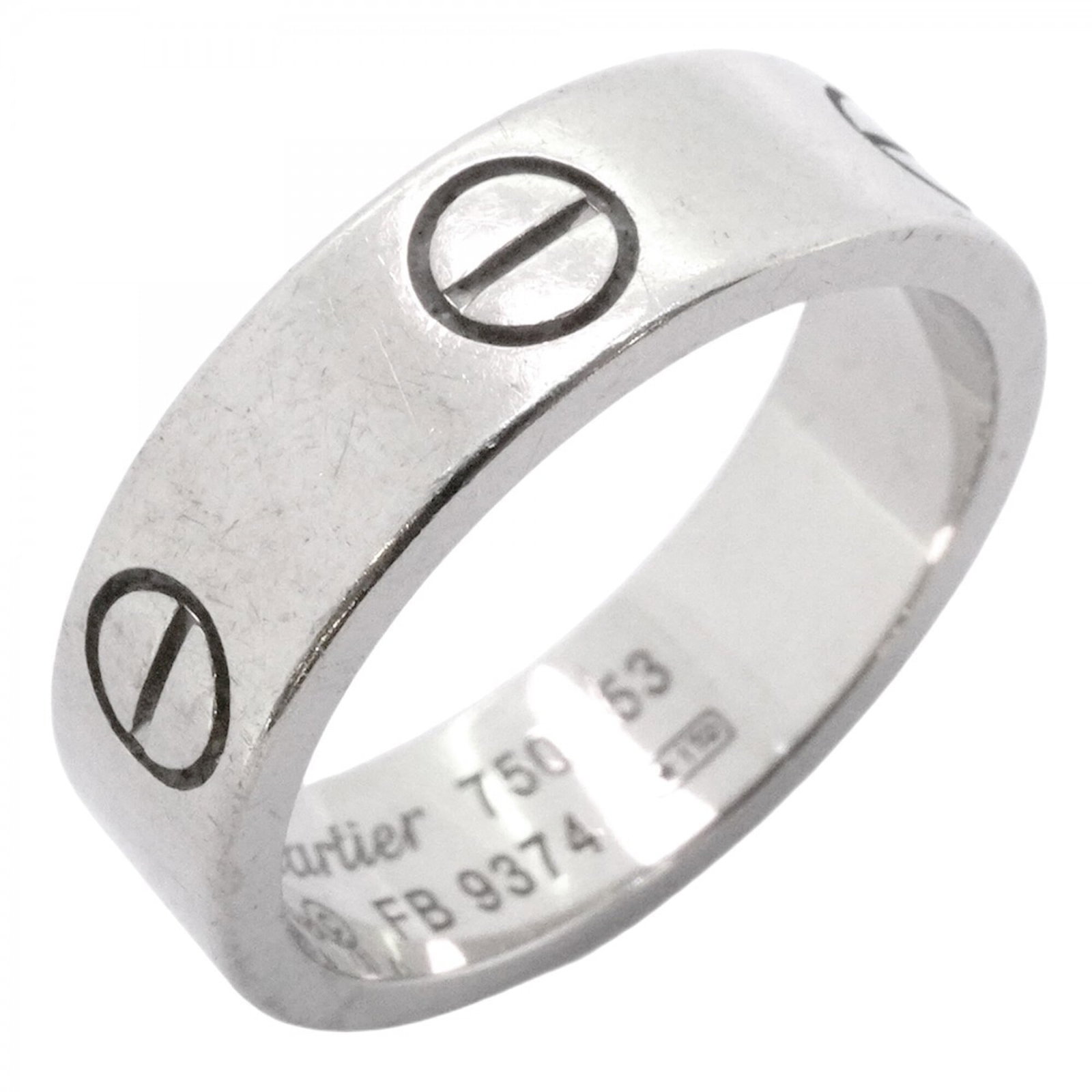 White Gold Cartier Band Ring 18K: White Gold Cartier Band Ring 18K White Gold Cartier Band Ring 18K features an 18K white gold band, bearing the iconic Cartier brand. The ring has been worn and shows signs of usage, with minor