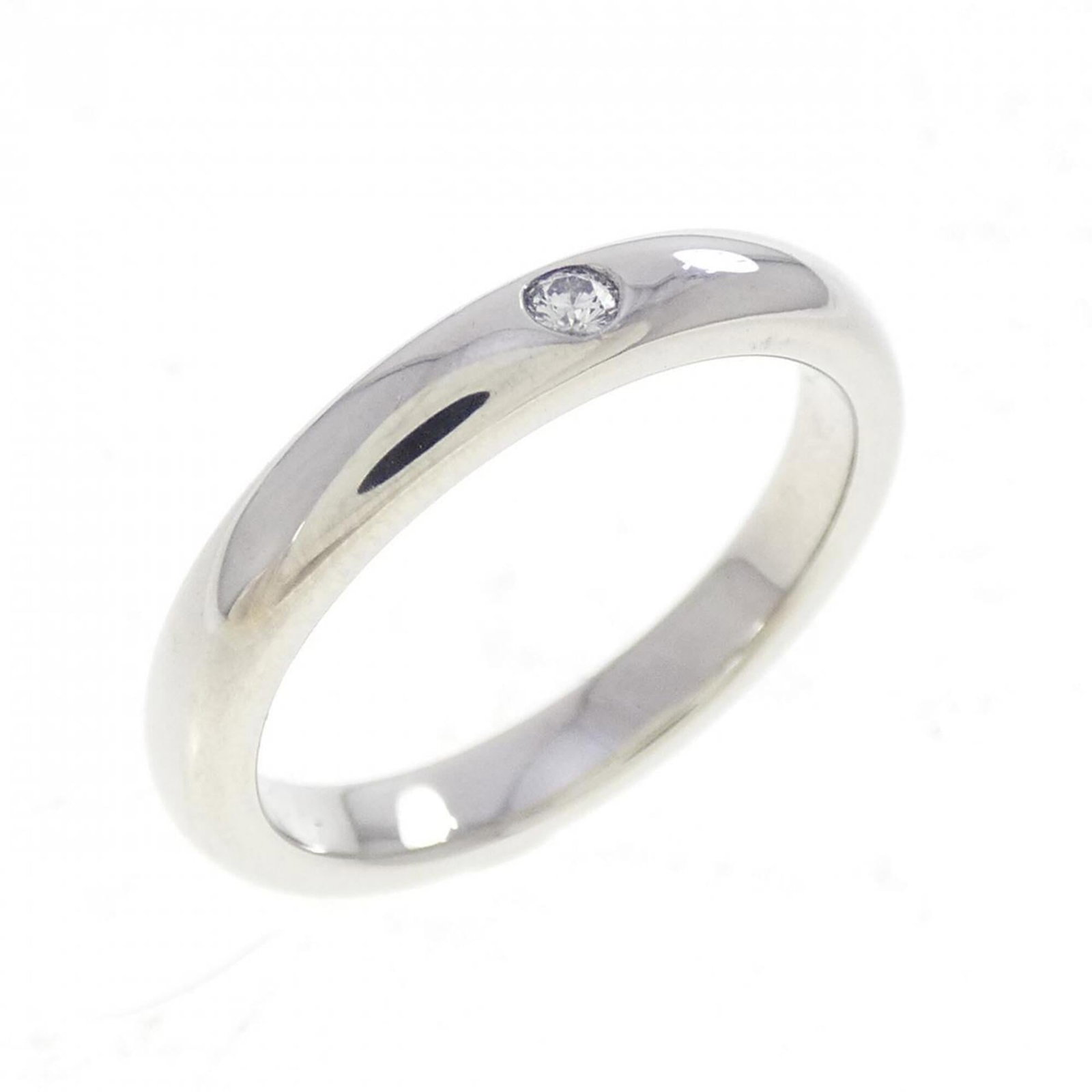 Platinum ring by Tiffany band: Platinum ring by Tiffany band Platinum ring by Tiffany features a diamond stone set in a band design. The item is made from platinum and has a us size of 4, with some minor scratches and dirt visible 