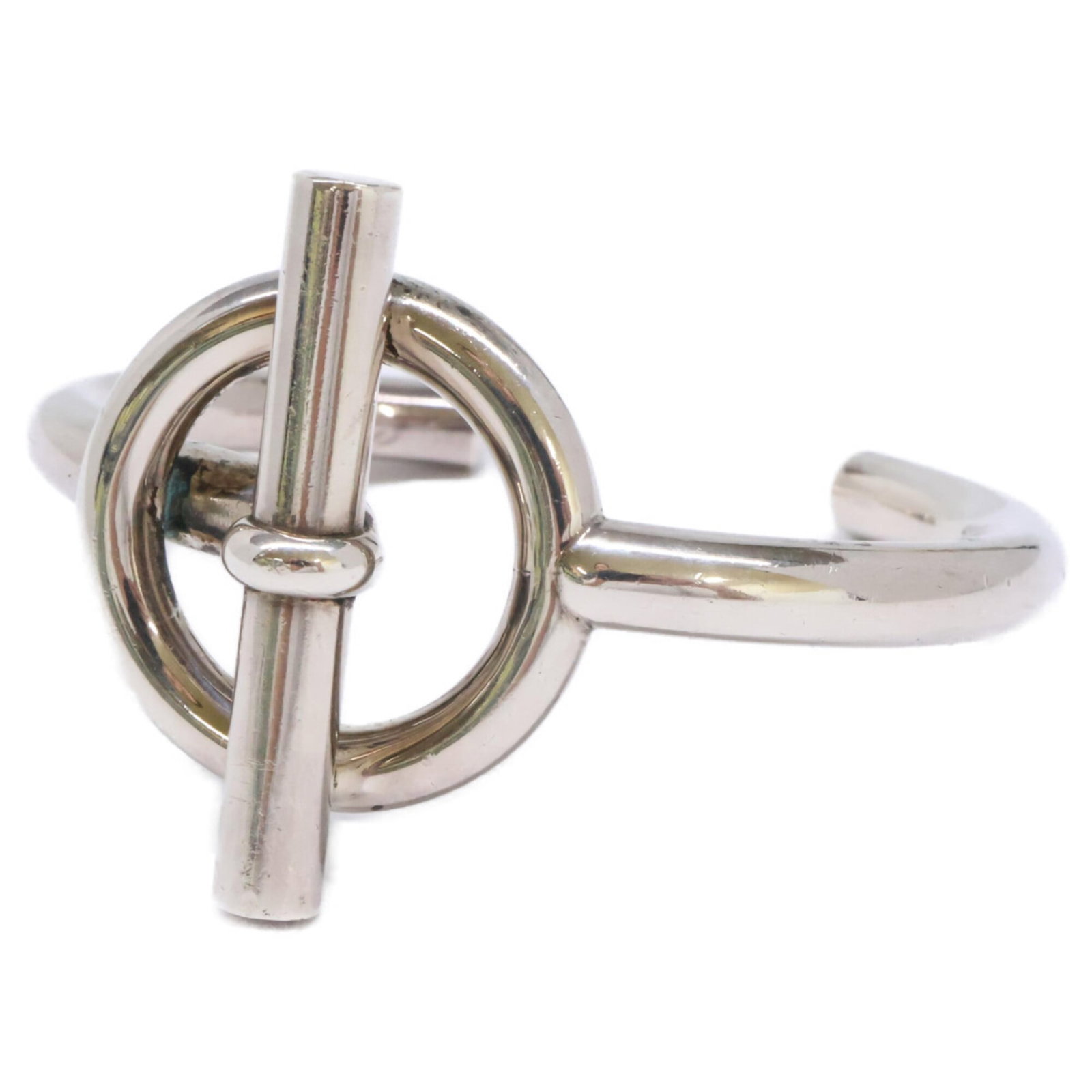 Hermes Bangle Silver 925: Hermes Bangle Silver 925 Silver 925 bangle from renowned luxury brand Hermes, bearing traces of usage and minor scratches. This pre-owned piece measures 15.5cm in length, offering a sleek and sophisti