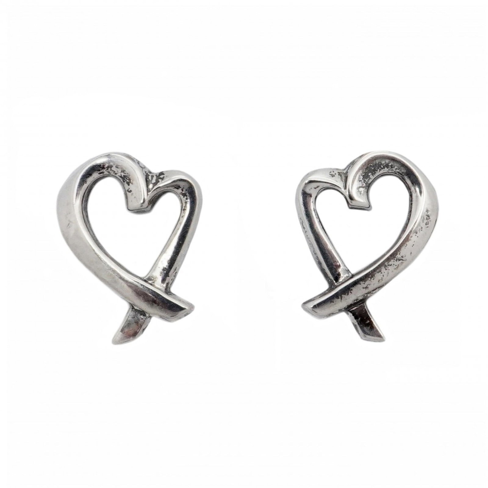 Silver 925 stud earrings by Tiffany: Silver 925 stud earrings by Tiffany Silver 925 stud earrings by Tiffany, featuring a classic design with subtle details. The earrings showcase a beautiful silver finish and measure 9.60mm x 7.50mm in