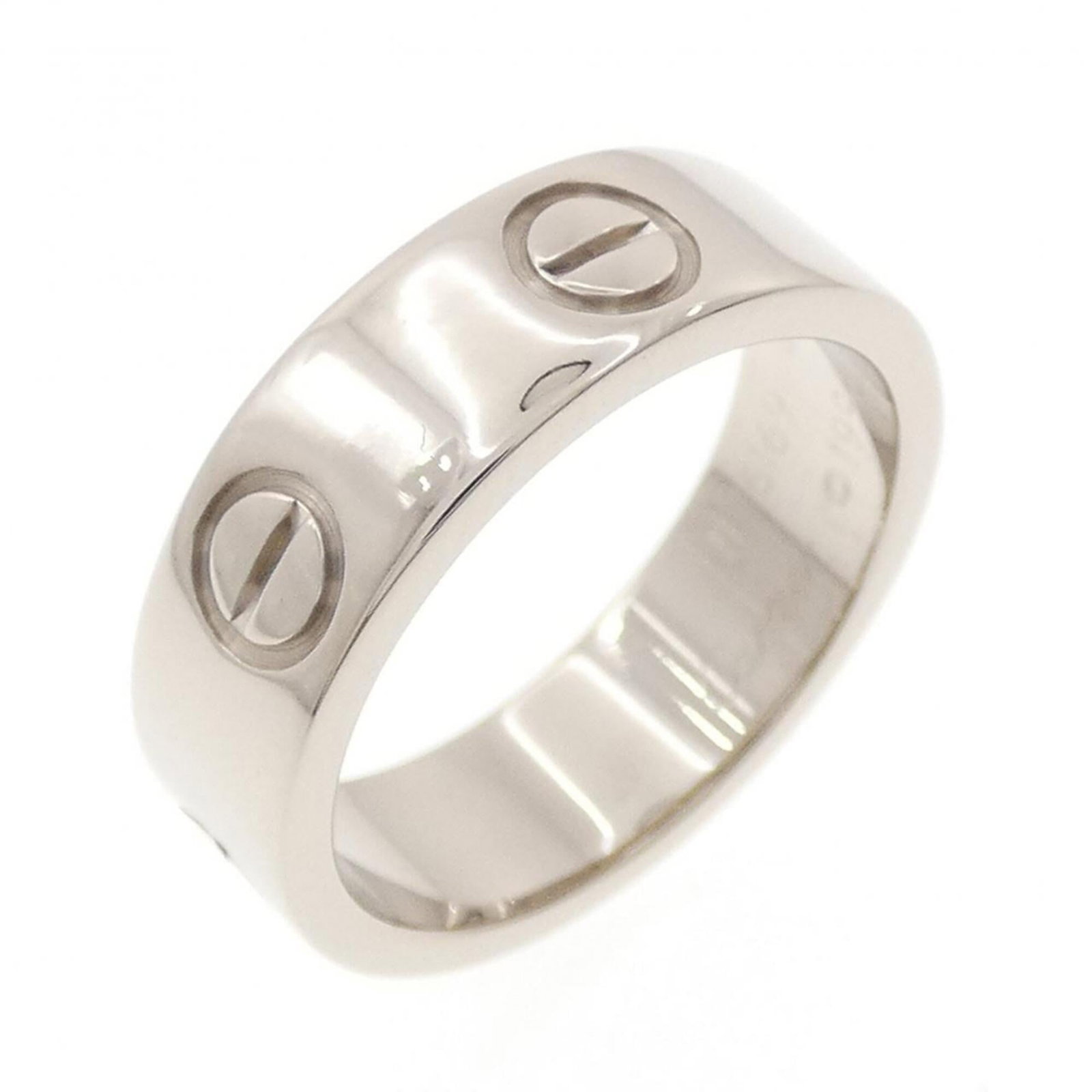 White Gold Cartier Band Ring 18K: White Gold Cartier Band Ring 18K White Gold Cartier Band Ring 18K features an 18k white gold band with a classic design, bearing a signature. The ring is in very good condition, showing only a few tra