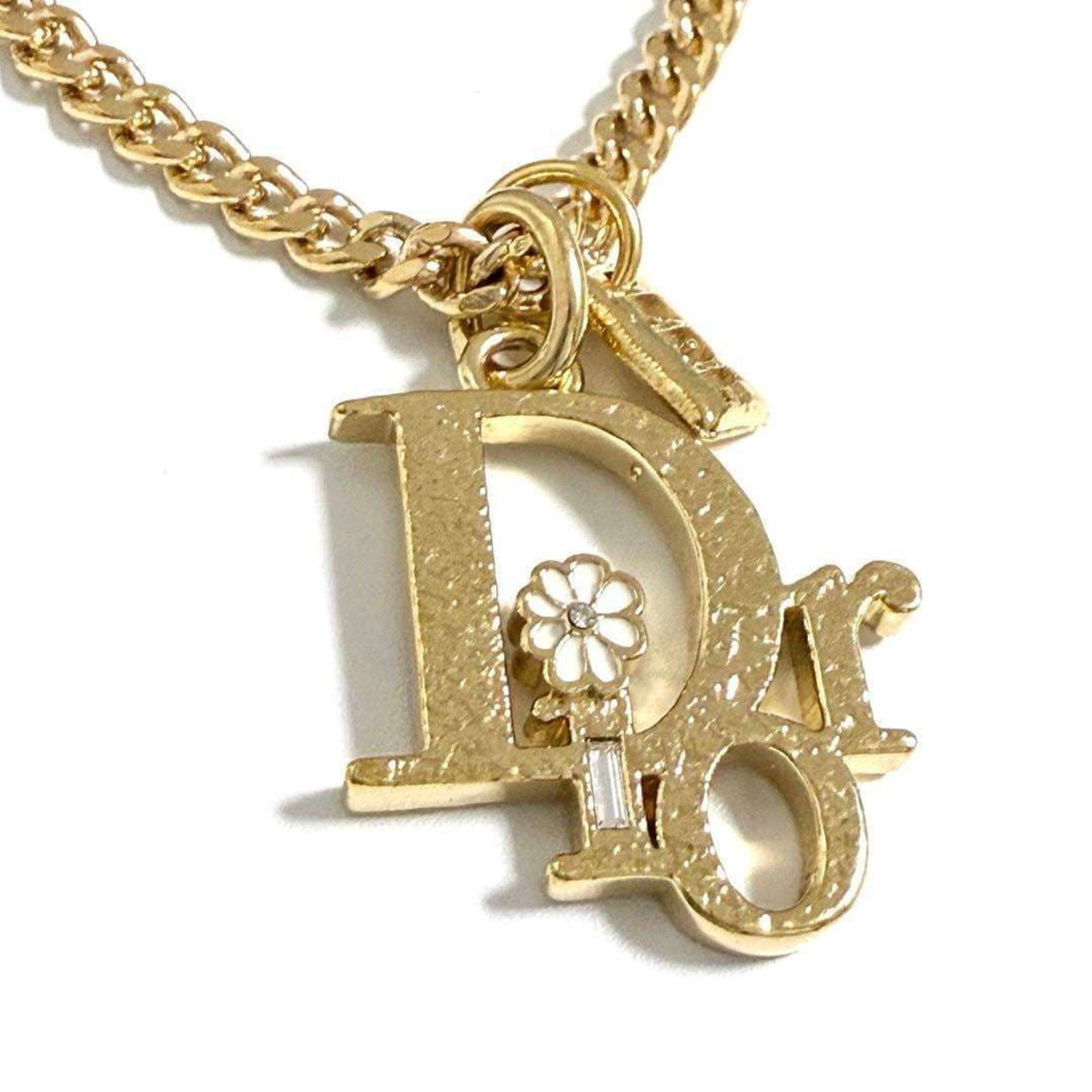 Christian Dior Men's Necklace Dior X Erl Collaboration: Christian Dior Men's Necklace Dior X Erl Collaboration The Dior X Erl Collaboration necklace features a striking design with metal and rhinestone details, making it a visually appealing accessory.