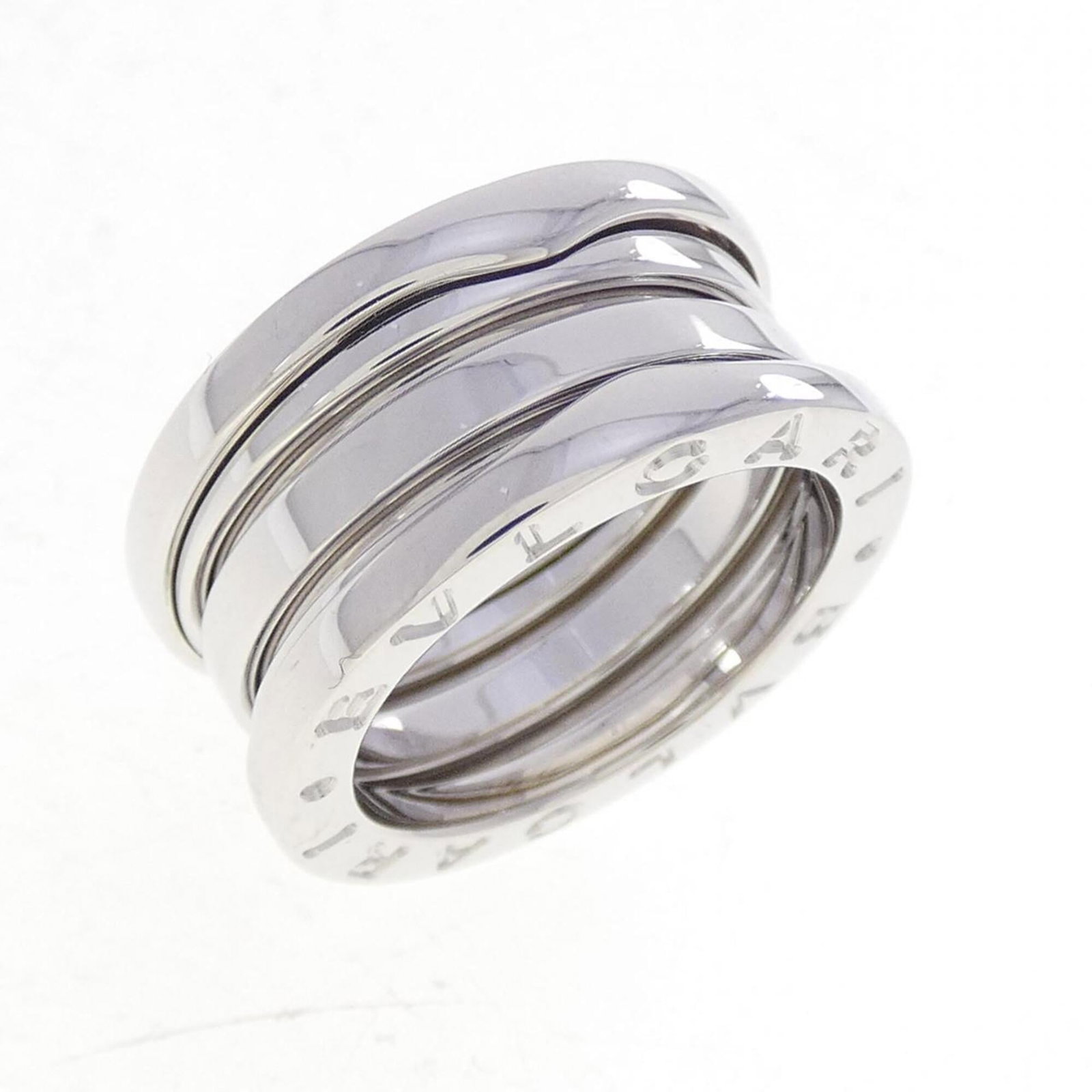 Bvlgari Band Ring White Gold (18K): Bvlgari Band Ring White Gold (18K) Bvlgari Band Ring White Gold (18K) - A sleek and sophisticated band ring crafted from high-quality white gold, featuring a classic design that exudes elegance. With