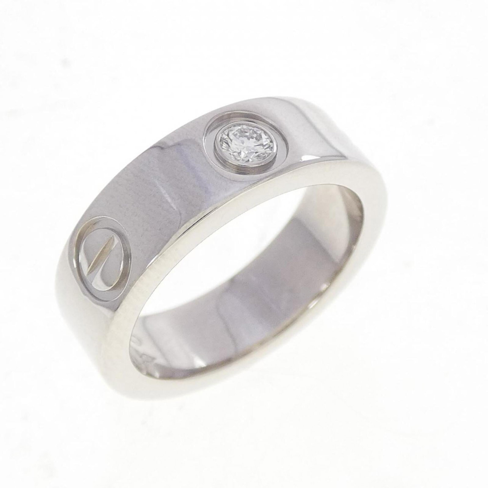 Ring Band by Platinum 950: Ring Band by Platinum 950 Platinum 950 band ring from Cartier, featuring a diamond stone and a sleek design. This used item is in like new condition with hardly any traces of usage. The ring's platinu