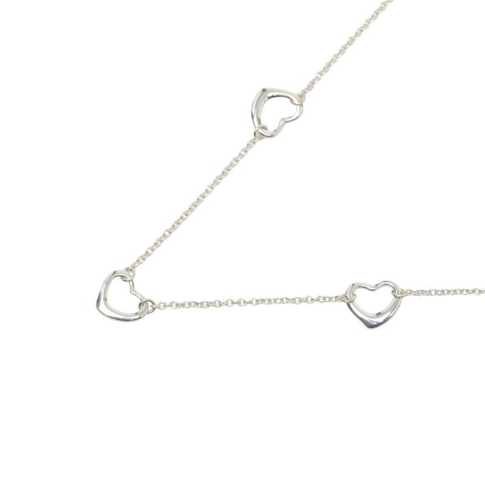 Tiffany & Co. Open Heart 3-Motif Necklace In 925 Sterling Silver For Women.: Tiffany & Co. Open Heart 3-Motif Necklace In 925 Sterling Silver For Women. Tiffany & Co. Open Heart 3-Motif Necklace in sterling silver features the iconic brand's signature three-motif design, a