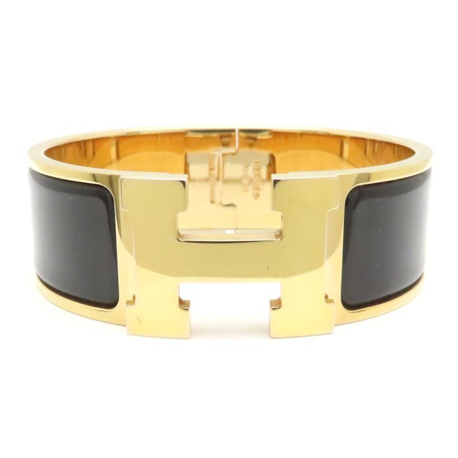Hermes Bangle Enamel Gold Plating: Hermes Bangle Enamel Gold Plating Enamel gold plating adds a touch of luxury to this iconic Hermes bangle, its 16.5cm length making it a stylish addition to any outfit. With traces of usage visible, t