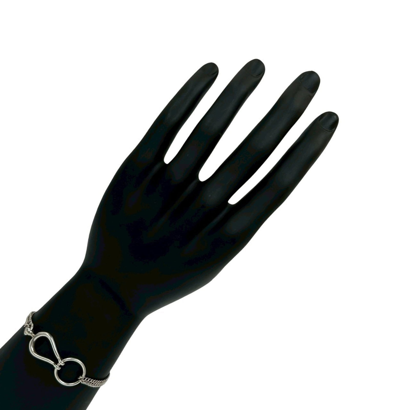 Silver Charm Bracelet 925 by Hermes: Silver Charm Bracelet 925 by Hermes Silver Charm Bracelet 925 by Hermes features a silver chain with a subtle charm, bearing the iconic brand's signature. The bracelet measures 18.2cm in length and ha