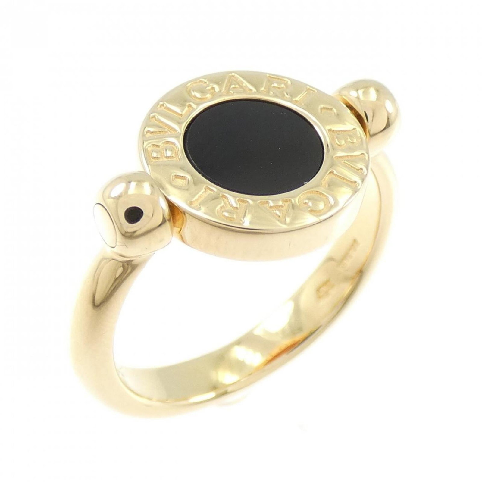 Bvlgari Band Ring: Bvlgari Band Ring Yellow gold Bvlgari band ring with an onyx stone, bearing a signature. The 18K gold ring has some scratches and dirt, but remains in very good condition. Weighing 6g, it features the