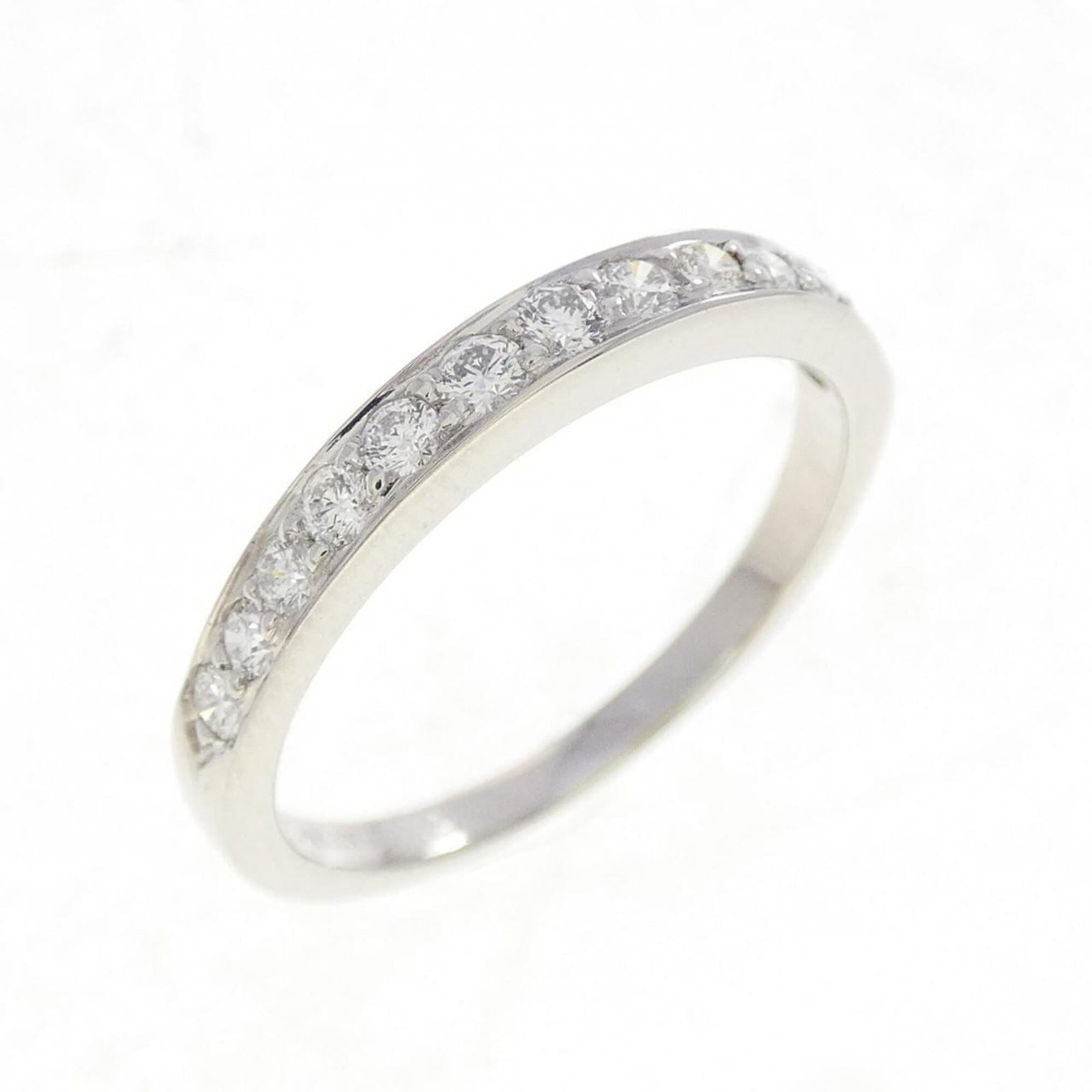 Platinum ring by Tiffany band: Platinum ring by Tiffany band Platinum ring by Tiffany & Co. features a diamond stone set in a high-quality platinum band, available in size 6. The ring has been well-cared for and shows some minor si