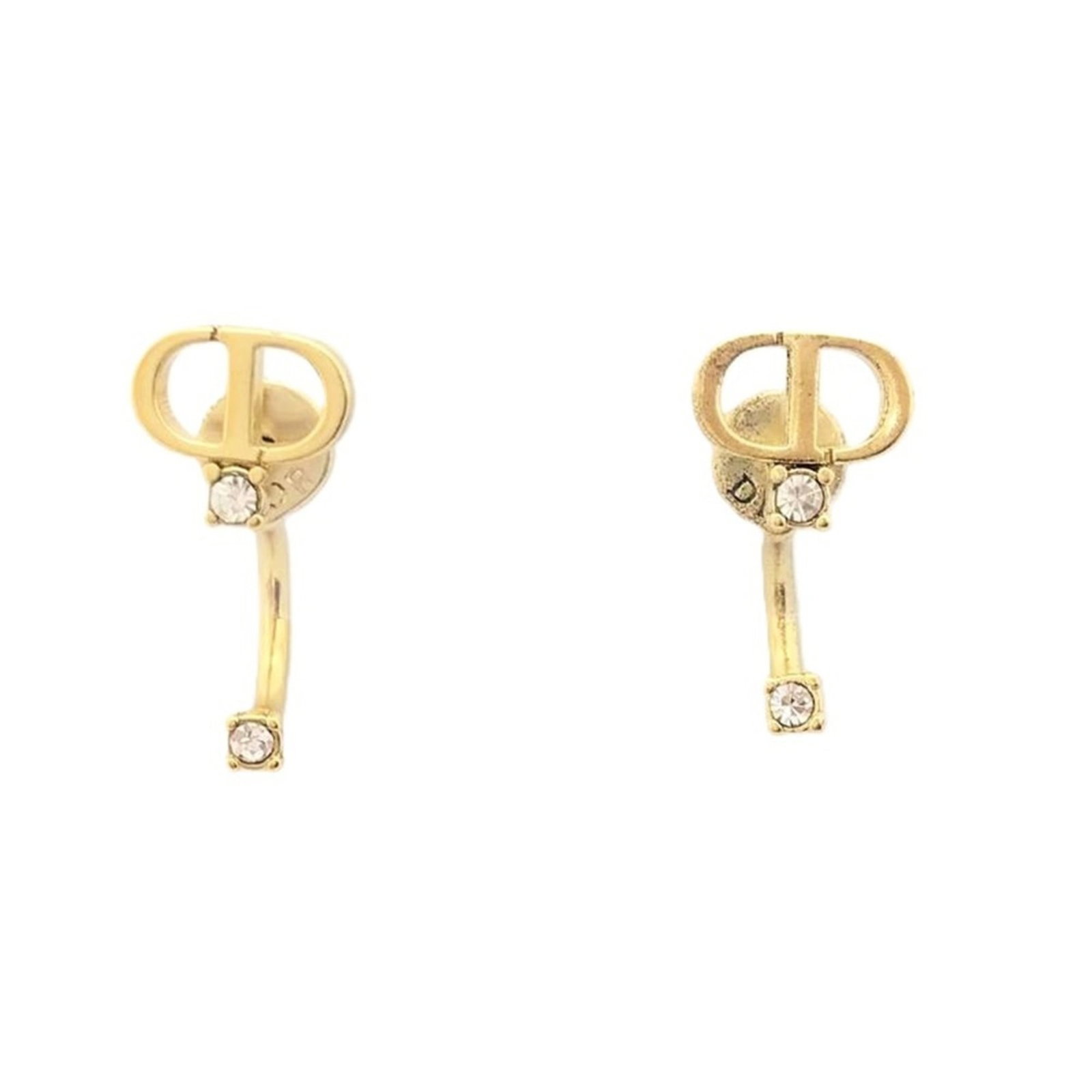 Stud Earrings by Christian Dior: Stud Earrings by Christian Dior Stud earrings by Christian Dior, featuring a gold finish and a distinctive design. The earrings are made from the specified material and have a size that matches the pr