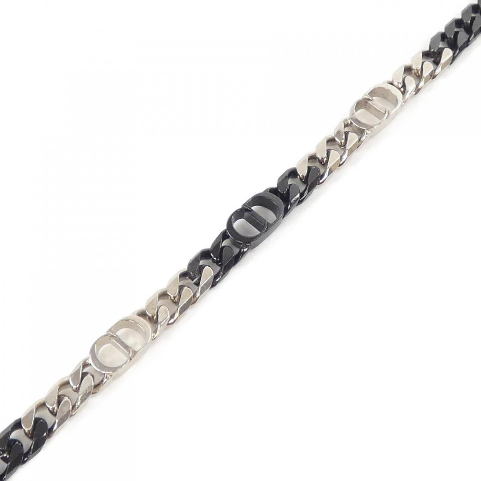 Dior Charm Christian: Dior Charm Christian The Dior Charm Christian bracelet boasts a sleek black design, measuring 25.5cm in length. With its traces of usage and minor damages visible, it remains in acceptable condition f