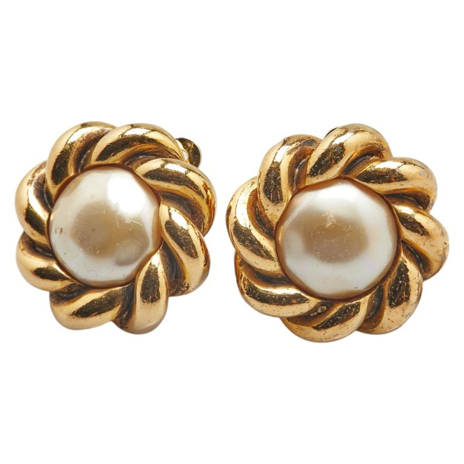 Chanel Clip Earrings: Chanel Clip Earrings Chanel Clip Earrings are available in gold, featuring a classic design with a pearl stone. The earrings have a subtle clip-on back and measure approximately 25.40mm x 25.40mm.