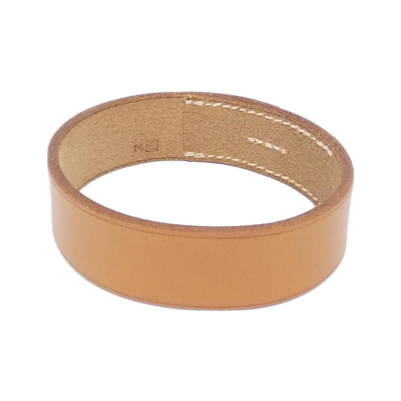 Hermes Bangle: Hermes Bangle Natural, high-quality leather wraps around the wrist in a classic bangle design from iconic French fashion house Hermes. The timeless piece boasts a subtle natural color and measures app