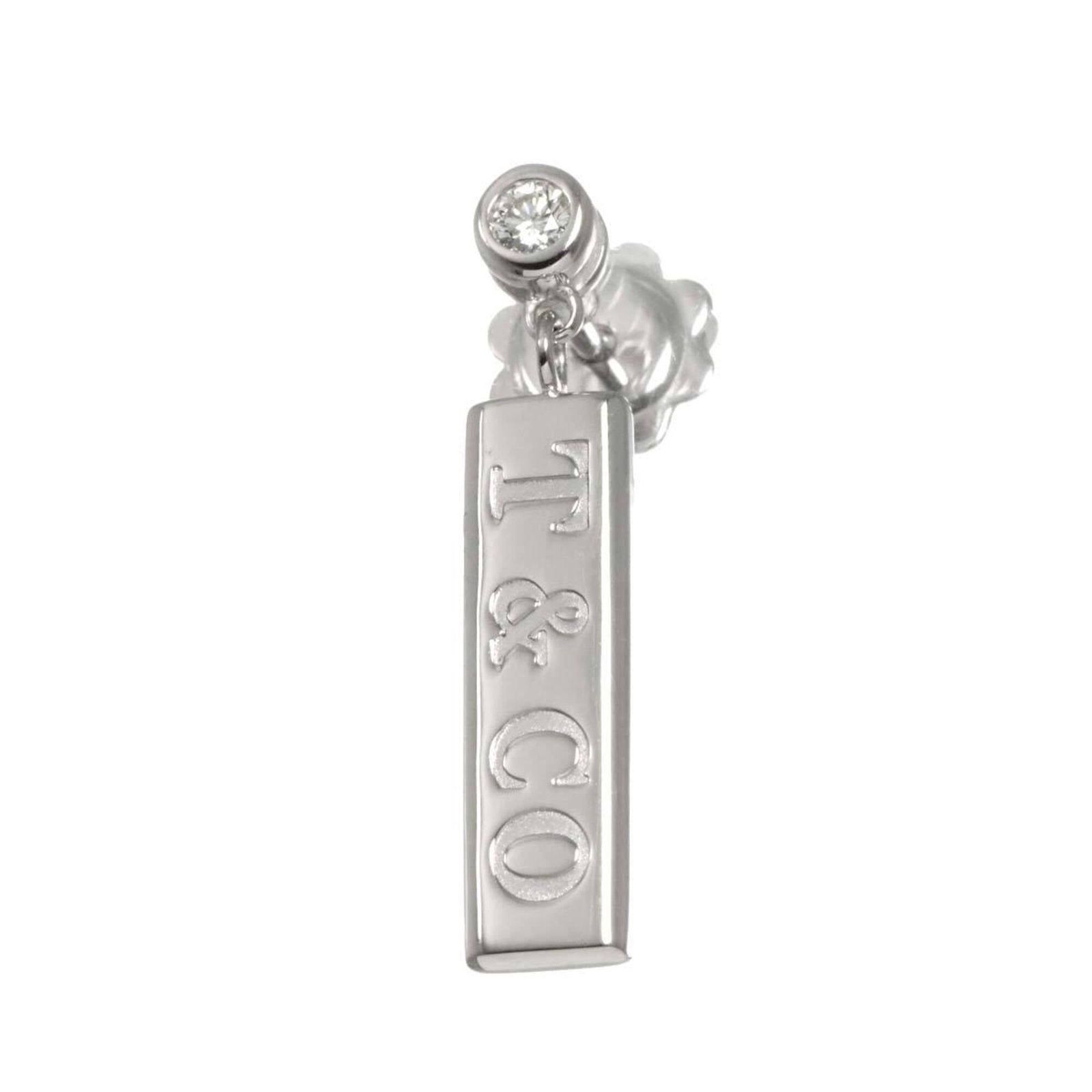 White Gold 18K Tiffany Stud Earrings: White Gold 18K Tiffany Stud Earrings White Gold 18K Tiffany Stud Earrings are crafted from high-quality white gold, offering a luxurious touch to any outfit. With their classic stud design and sleek p
