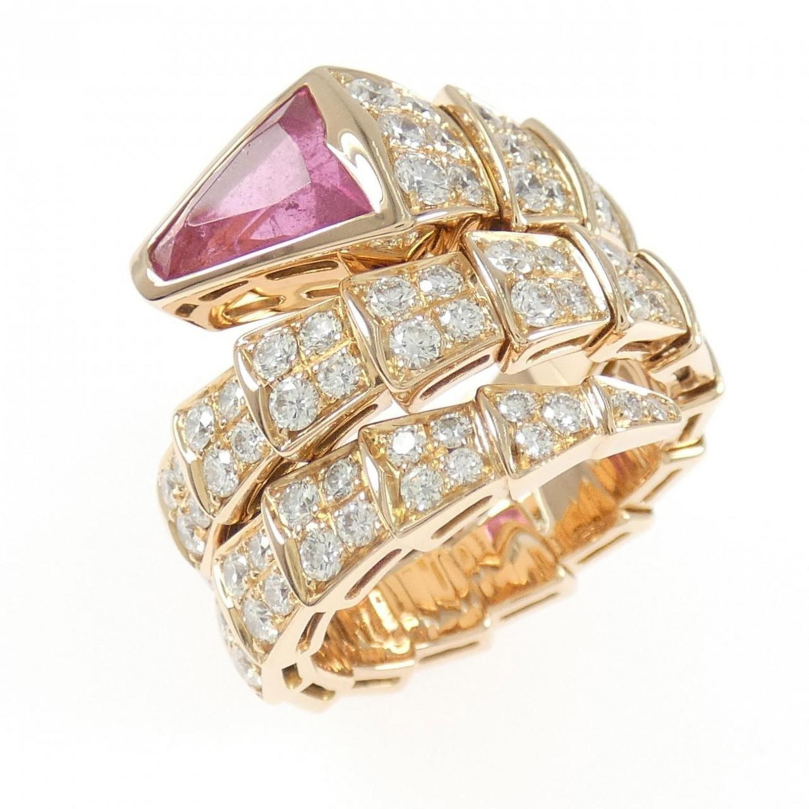 Pink Gold 18K Bvlgari Band Ring: Pink Gold 18K Bvlgari Band Ring Pink Gold 18K Bvlgari Band Ring features a beautiful diamond and tourmaline stone set in 18K pink gold. The ring boasts a classic band design, showcasing the elegance