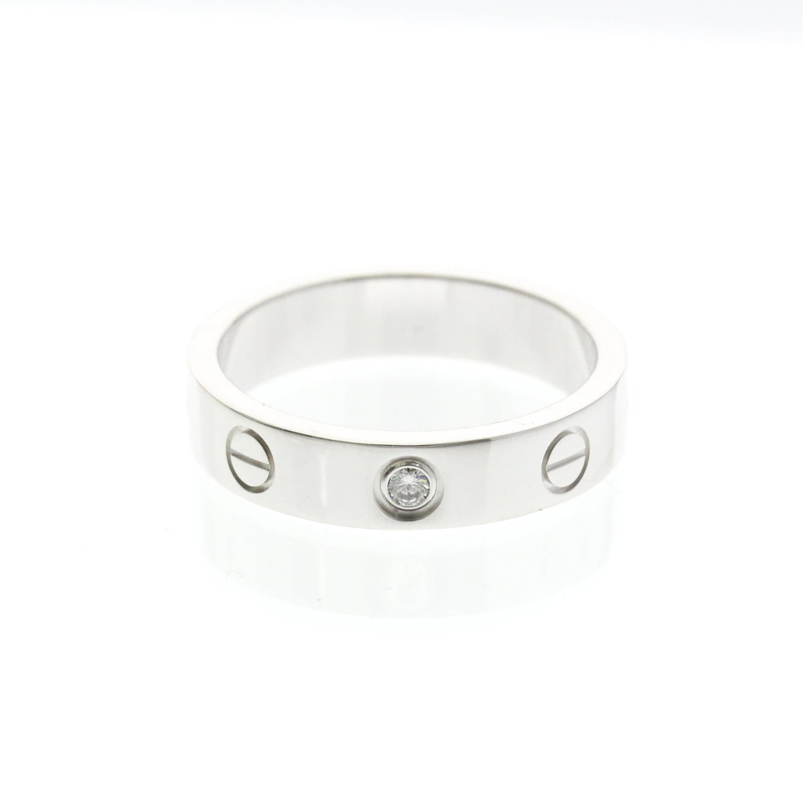White Gold Cartier Band Ring 18K: White Gold Cartier Band Ring 18K White Gold Cartier Band Ring 18K features an elegant design with a silver finish, crafted from 18K white gold metal. This band ring boasts a diamond stone and measures