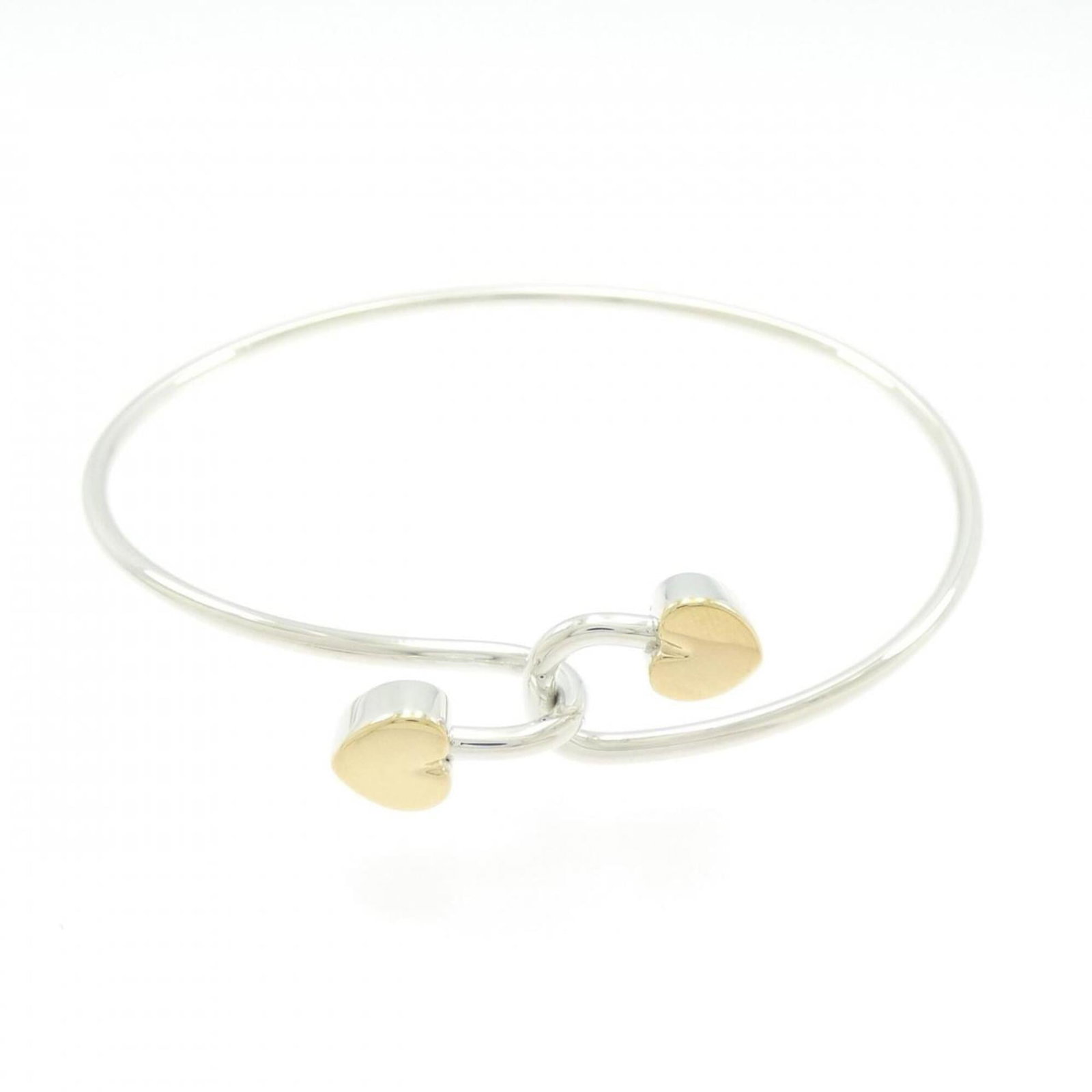 Tiffany Bangle Silver 925 Yellow Gold (18K): Tiffany Bangle Silver 925 Yellow Gold (18K) Silver and yellow gold bangle from Tiffany, crafted from high-quality 925 silver with an 18K yellow gold accent. Measuring 17.5cm in length, this elegant