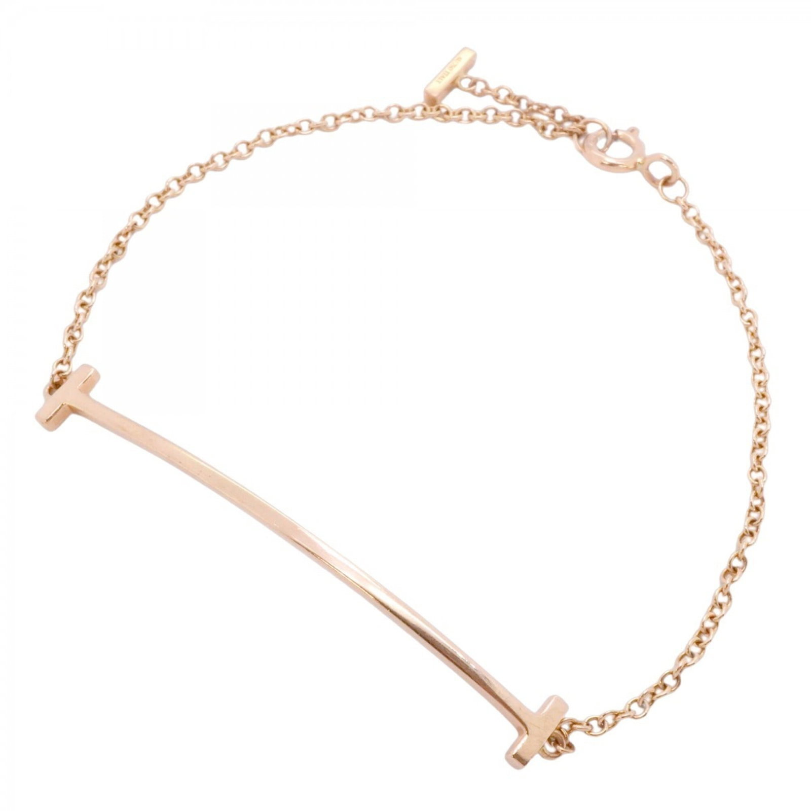 Pink Gold 18K Tiffany Charm Bracelet: Pink Gold 18K Tiffany Charm Bracelet Pink Gold 18K Tiffany Charm Bracelet - A delicate and elegant charm bracelet in pink gold, featuring the iconic Tiffany brand. The 16cm length offers a versatile