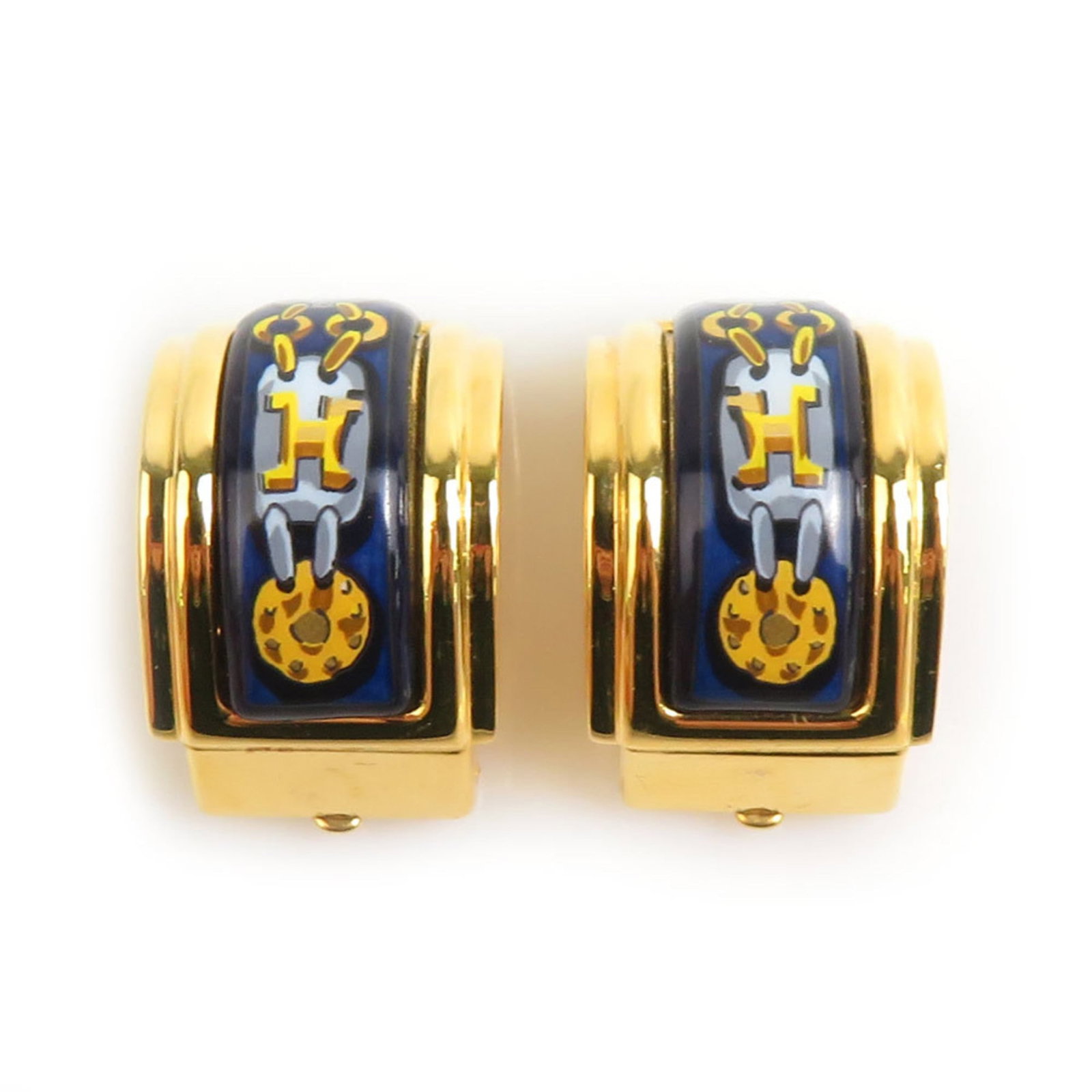 Enamel metal Hermes earrings clip: Enamel metal Hermes earrings clip Gold and navy enamel metal Hermes clip earrings, bearing the iconic brand's signature style. With a subtle gold finish and striking navy accents, these earrings