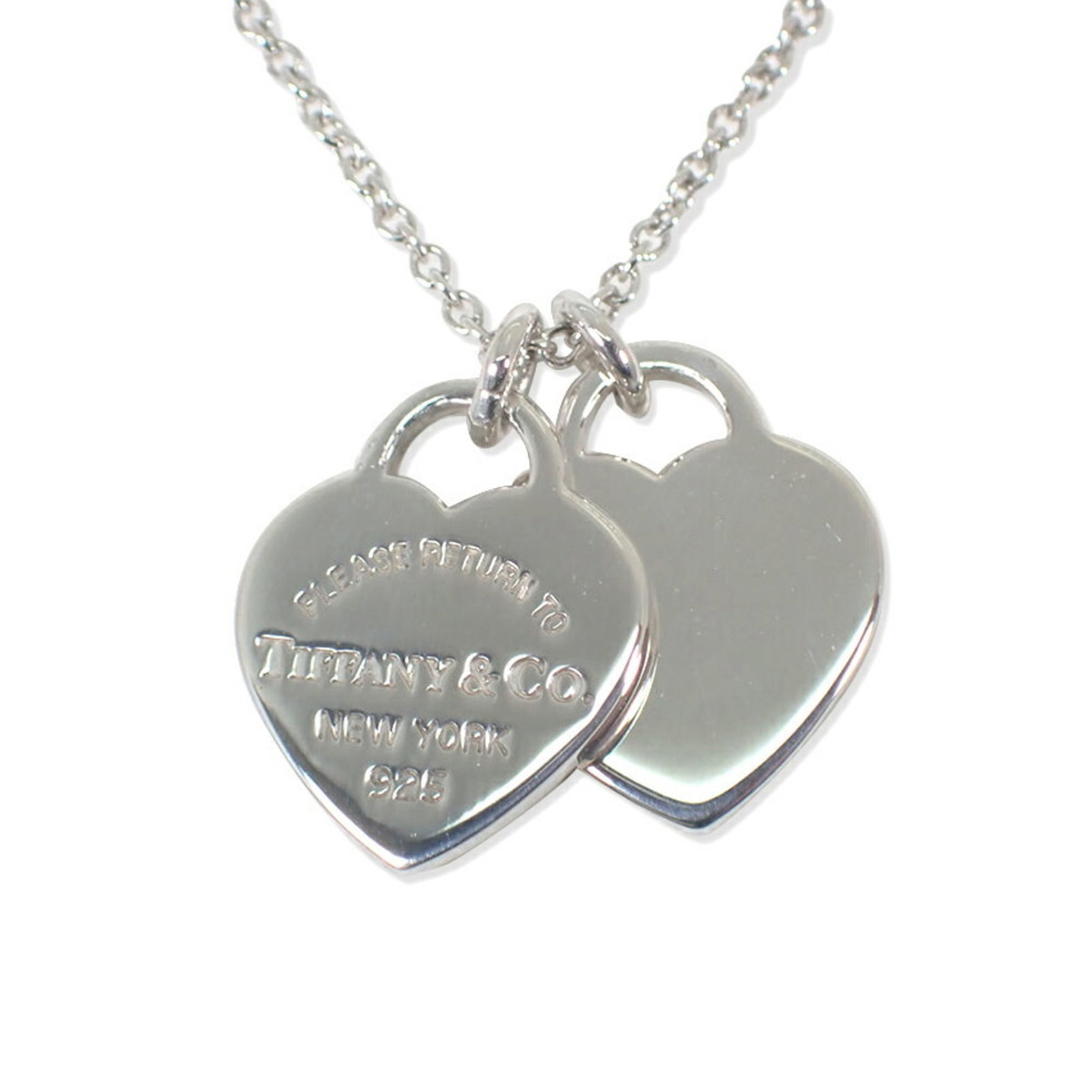 Tiffany & Co. 925 Return To Tiffany Double Heart Tag Pendant: Tiffany & Co. 925 Return To Tiffany Double Heart Tag Pendant Sterling silver pendant from Tiffany & Co., featuring the iconic Return To Tiffany double heart tag design, measuring 12mm x 10mm. The neck