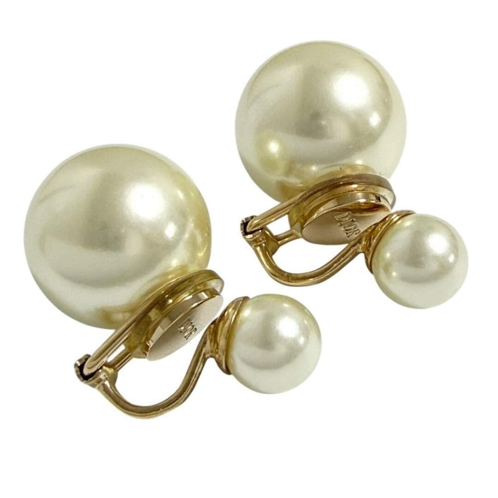 Clip Earrings in Artificial Pearl Metal by Christian Dior: Clip Earrings in Artificial Pearl Metal by Christian Dior Clip earrings in artificial pearl metal by Christian Dior, featuring a sleek and sophisticated design. Made from high-quality artificial