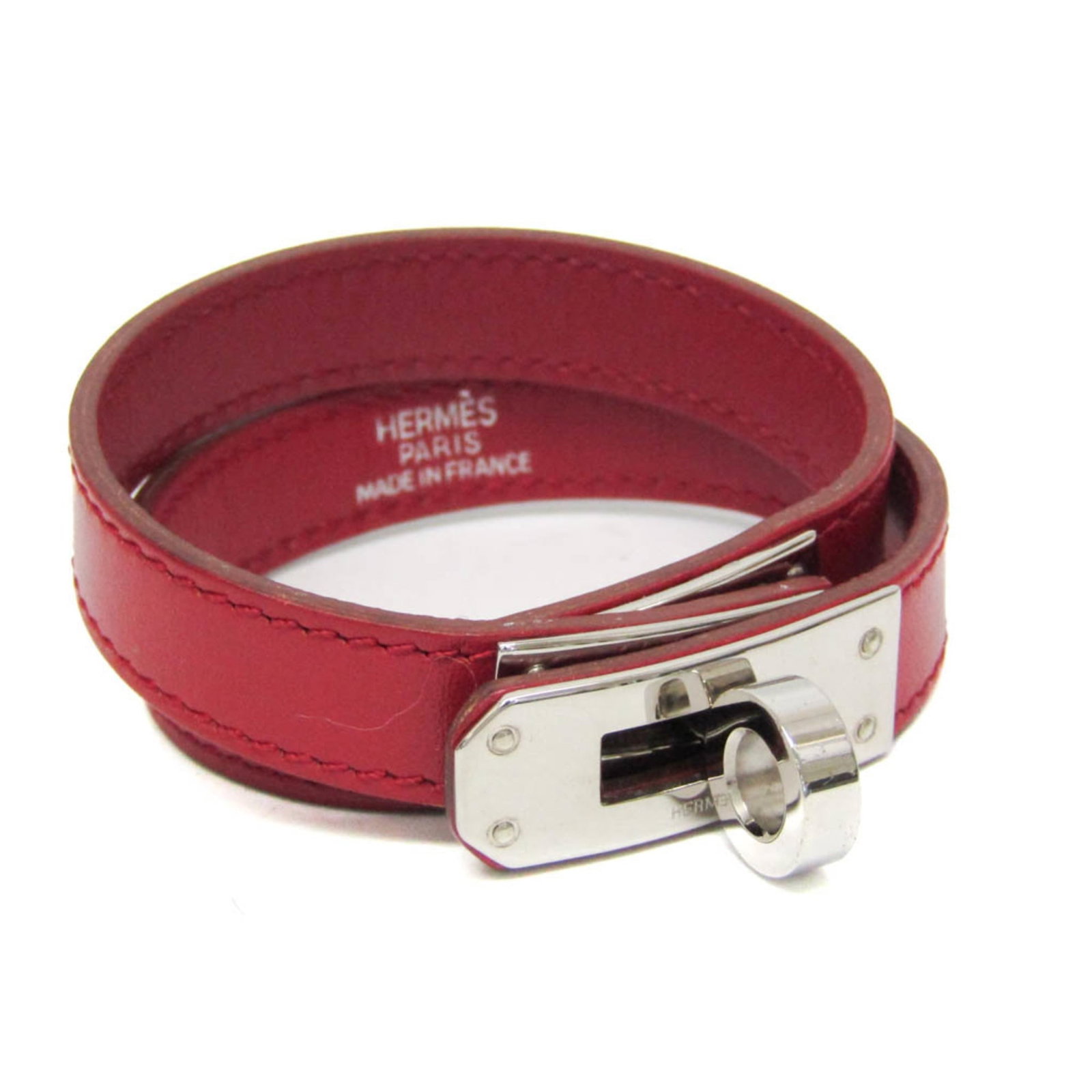 Metal leather bangle Hermes: Metal leather bangle Hermes This stunning metal leather bangle from Hermes boasts a bold red color and sleek silver accents, adding a touch of sophistication to any outfit. Made from high-quality