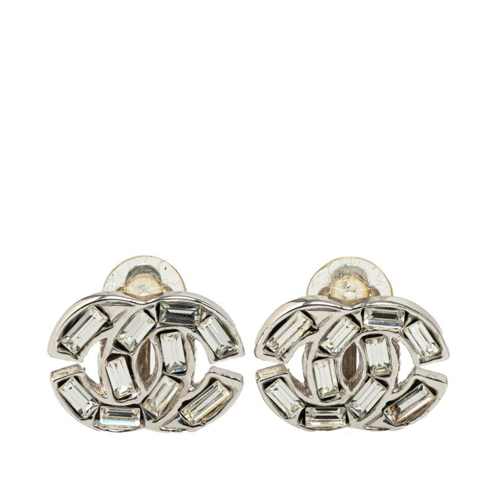 Clip earrings gold plating by Chanel: Clip earrings gold plating by Chanel Clip earrings in gold plating by Chanel, featuring rhinestone stones. Made from silver-toned metal with a vintage aesthetic, these clip earrings showcase the iconi