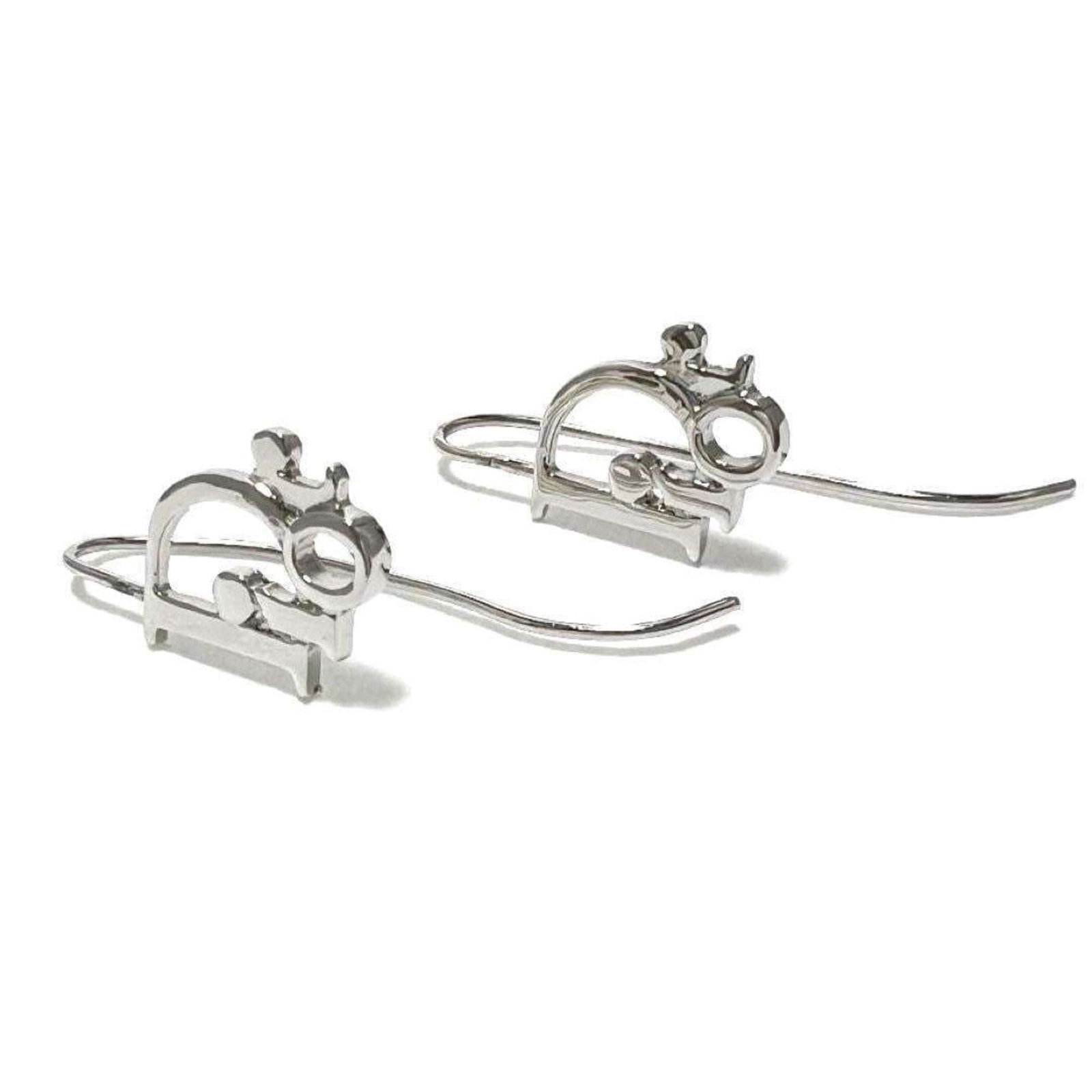 Dior Christian Metal Drop Earrings: Dior Christian Metal Drop Earrings Used Christian Dior Metal Drop Earrings in very good condition, with a few traces of usage and minor scratches/dirt. The earrings feature metal construction and bear
