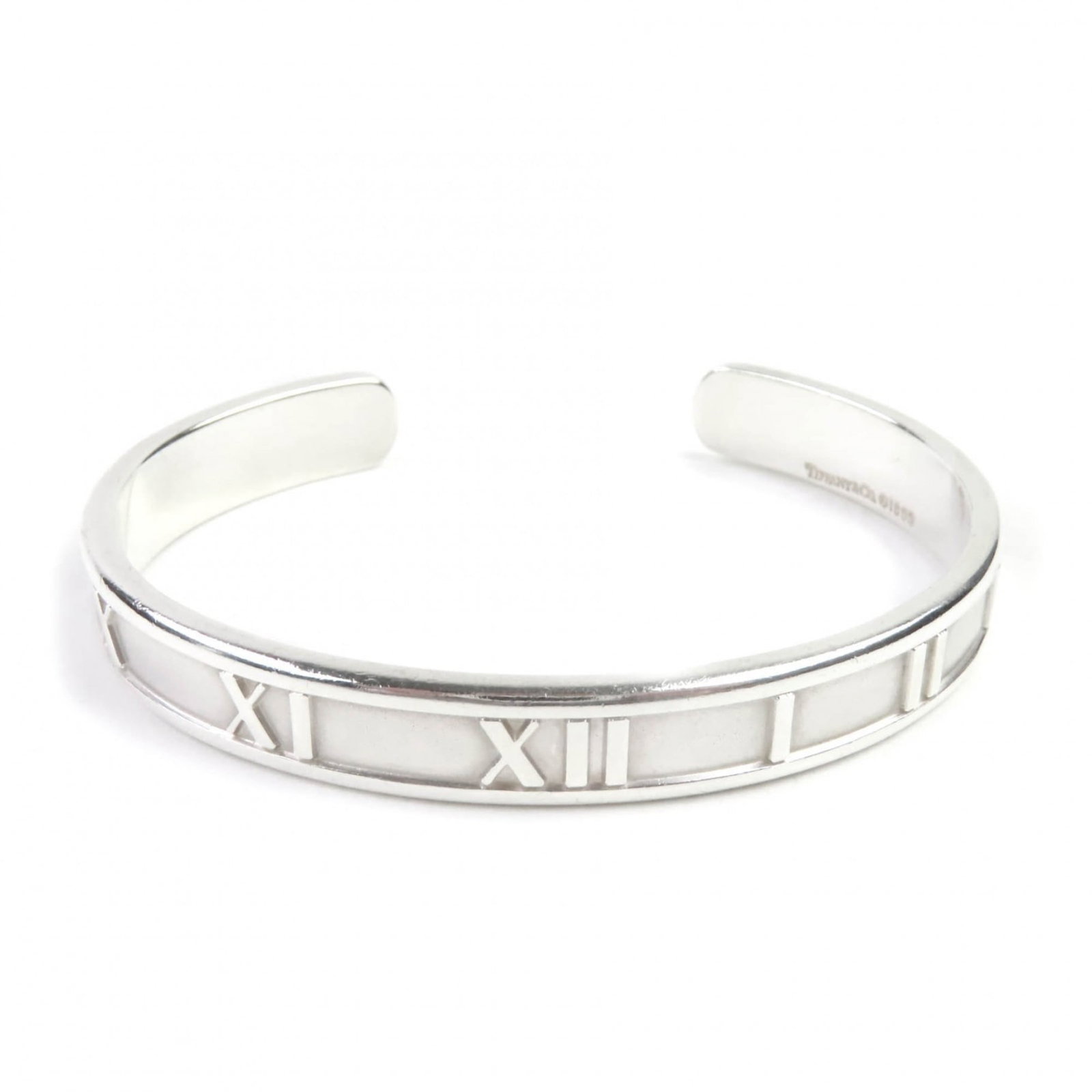 Tiffany Bangle: Tiffany Bangle Silver Tiffany Bangle, measuring 12.5cm in length and featuring a 6mm width, bears the mark of its vintage condition with some traces of usage visible. The bangle's silver925 metal is
