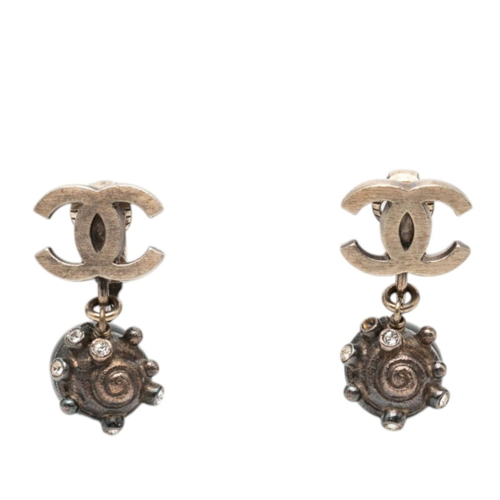 Metal Rhinestone Clip Chanel Earrings: Metal Rhinestone Clip Chanel Earrings Metal Rhinestone Clip Chanel Earrings in Black and Silver, featuring intricate metal work and sparkling rhinestones, are a statement piece for any woman's collect