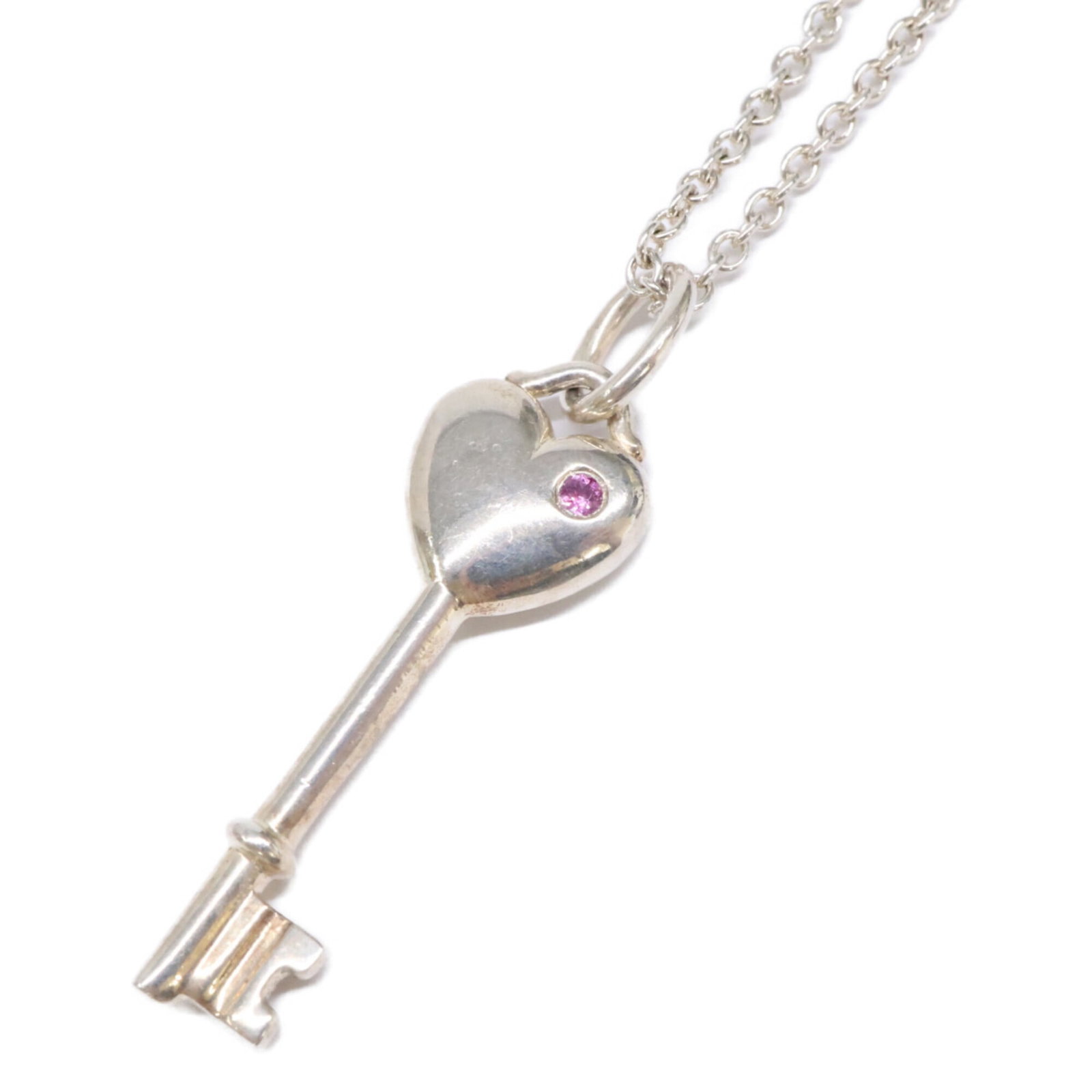 Tiffany&Co. Tiffany & Co. 925 Elsa Peretti 1P Pink Sapphire Heart Key Pendant Necklace Silver: Tiffany&Co. Tiffany & Co. 925 Elsa Peretti 1P Pink Sapphire Heart Key Pendant Necklace Silver Tiffany & Co.'s iconic Elsa Peretti design, featuring a stunning pink sapphire heart set in sterling silve