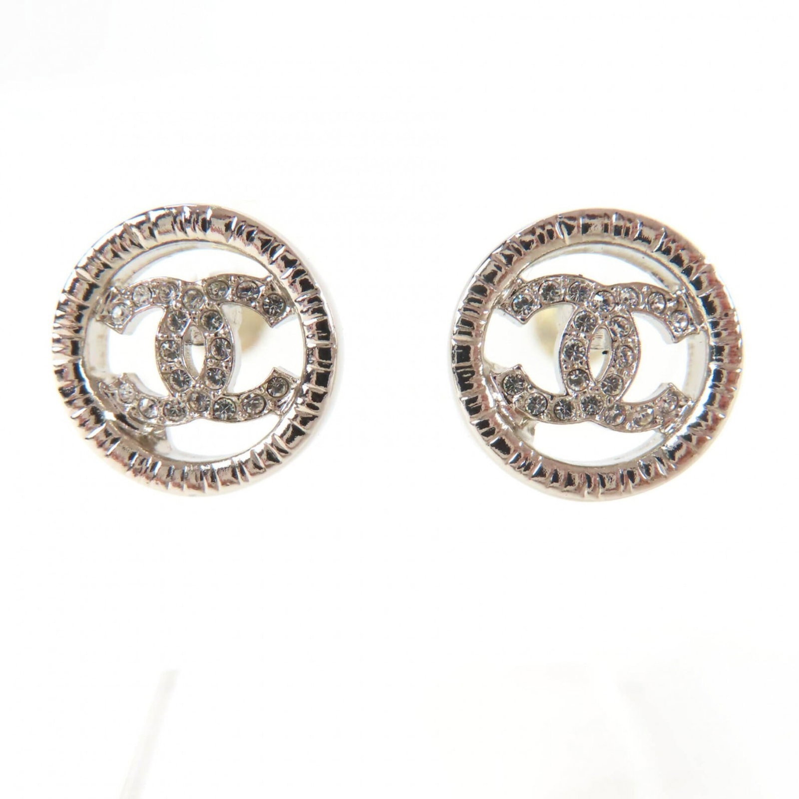 Stud Earrings Metal by Chanel: Stud Earrings Metal by Chanel Stud earrings by Chanel in silver metal, featuring a diameter of 1.3mm / 0.05''. In mint condition like new, these stud earrings are made from high-quality metal and
