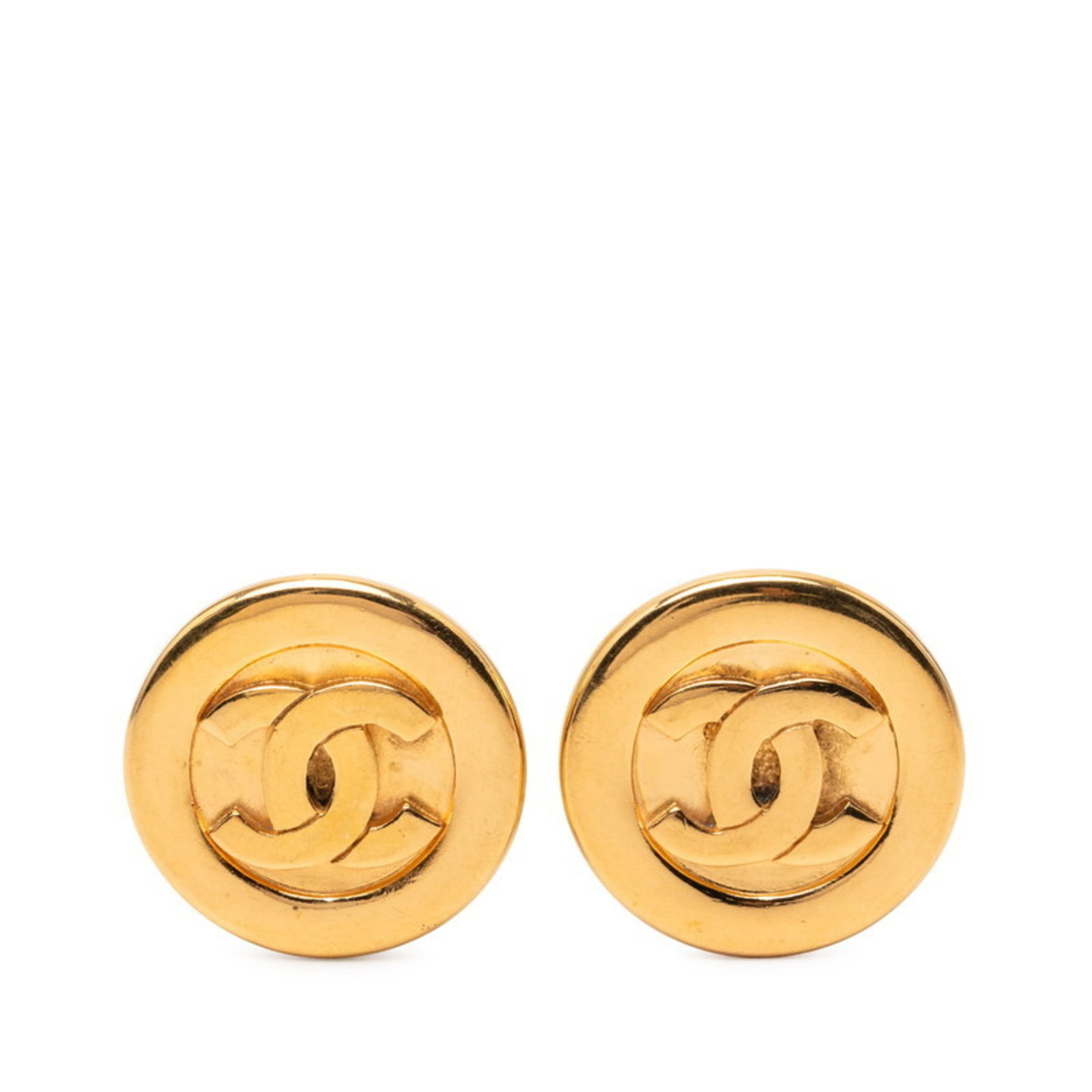Chanel Clip Earrings: Chanel Clip Earrings Chanel Clip Earrings in Gold, featuring the iconic interlocking CC design. Made from high-quality materials, these earrings showcase a subtle gold finish and measure 27.90mm x