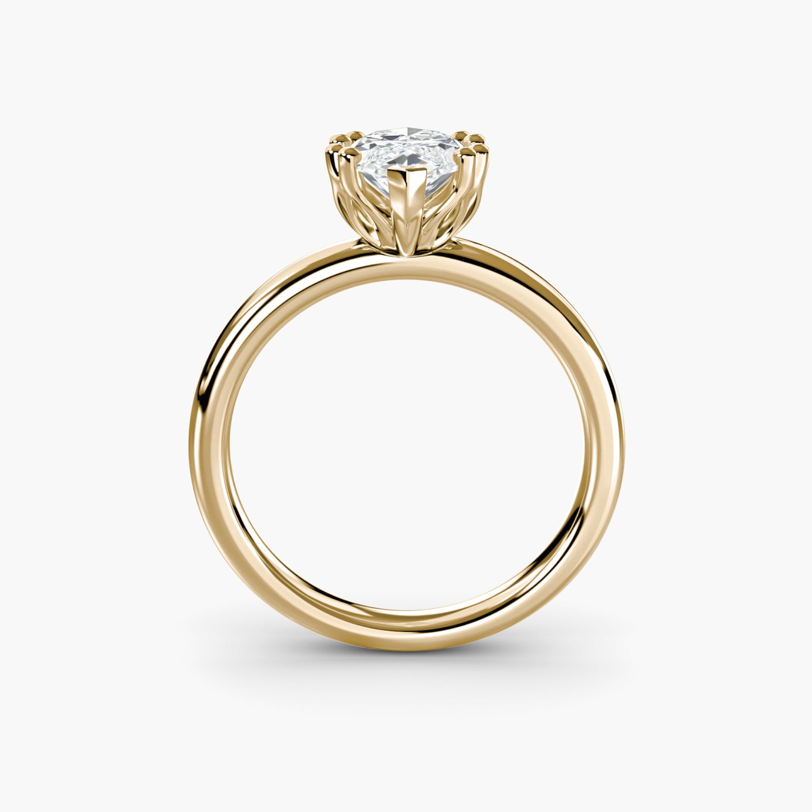Solitaire Marquise 14Kt Yellow Gold Ring Setting: Solitaire Marquise 14Kt Yellow Gold Ring Setting Marquise shape adds an elegant twist to this 14Kt yellow gold ring setting, showcasing its slender profile and pointed ends. The metal weight of 3.87