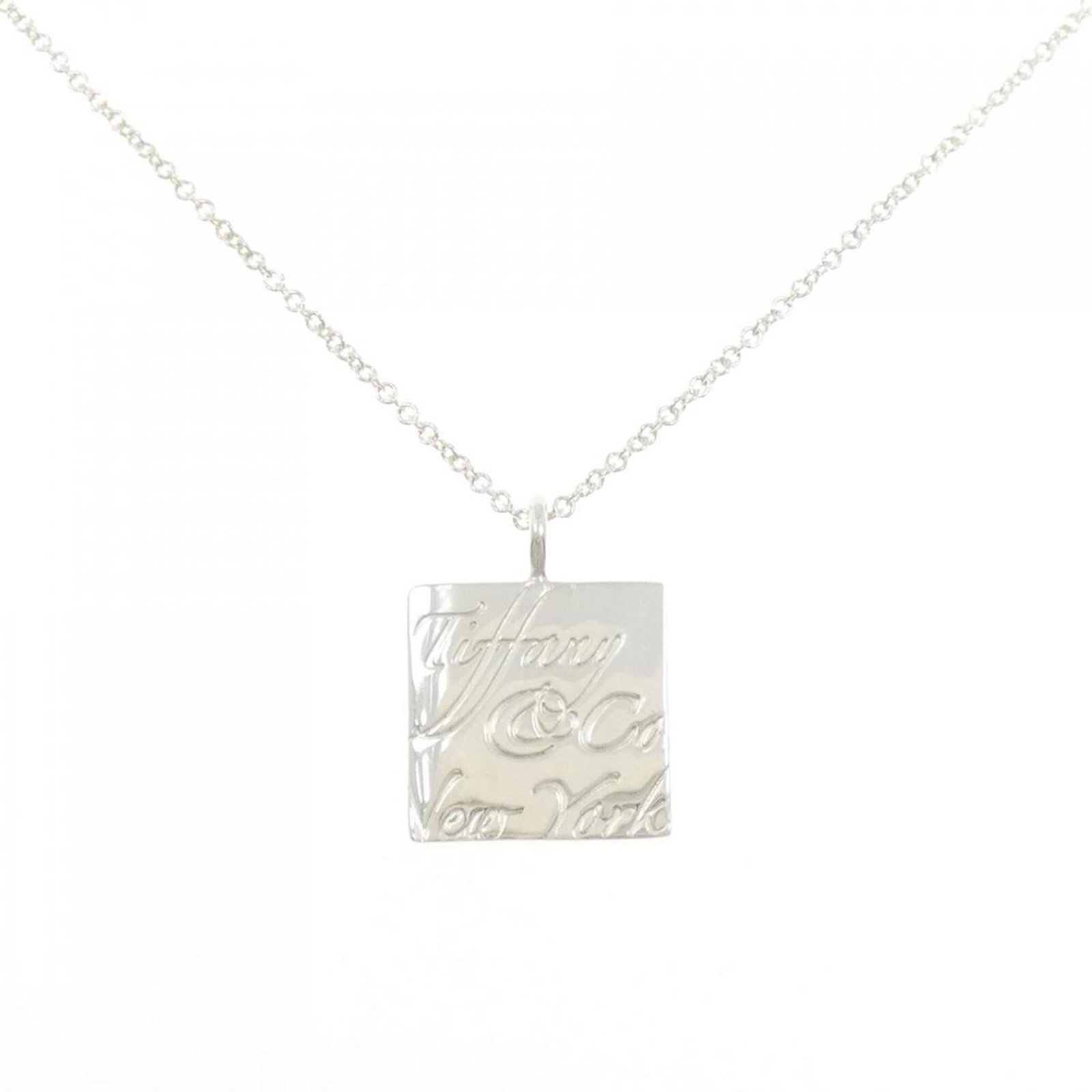 Notes Square Necklace Tiffany: Notes Square Necklace Tiffany The Notes Square Necklace Tiffany boasts a sleek silver design with a subtle, sophisticated charm. Made from high-quality 925 silver, this necklace features a striking