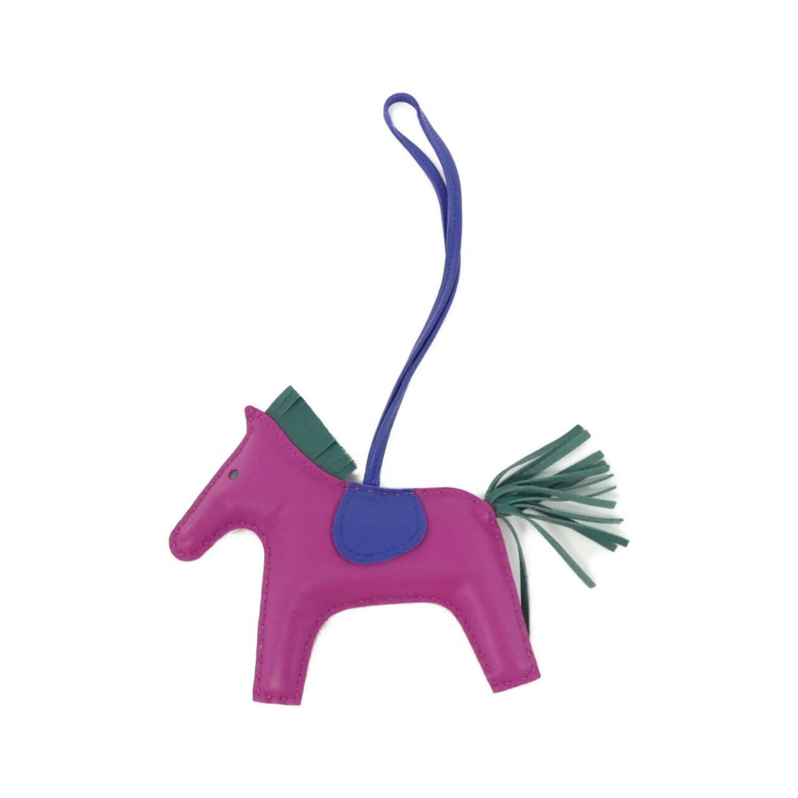 Hermes Handbag Charm Agneau Milo: Hermes Handbag Charm Agneau Milo Agneau Milo, the iconic material used in Hermes' Handbag Charm, adds an air of sophistication to this unique accessory. The blue hue and sleek design make it a stylish