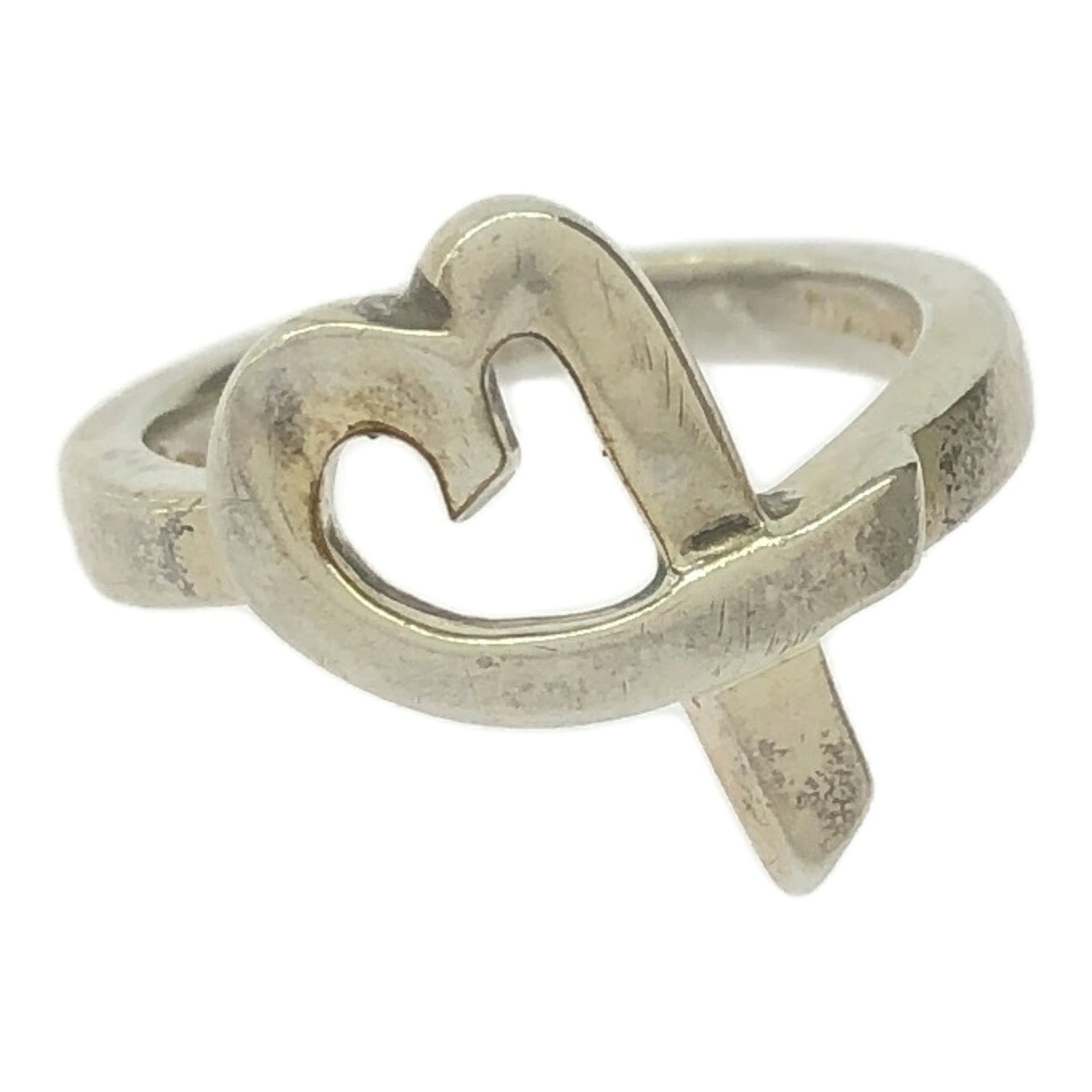 Tiffany Band Ring Silver 925: Tiffany Band Ring Silver 925 Silver 925 band ring from Tiffany, available in women's size 5 with a width of 3mm. This used silver ring bears traces of usage and minor damages but remains in acceptable
