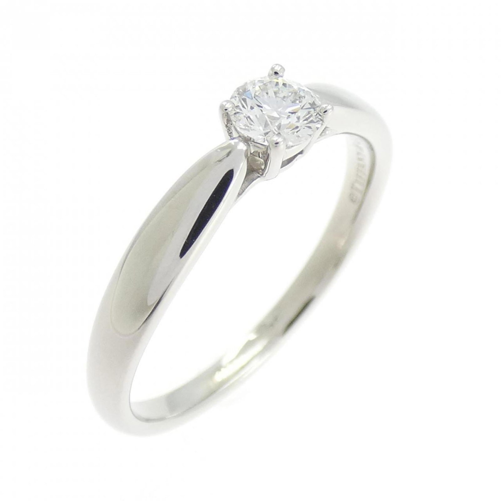 Platinum ring by Tiffany band: Platinum ring by Tiffany band Platinum ring by Tiffany & Co. features a diamond stone set in a high-quality platinum band, available in size 6. The ring has been well-cared for and shows some minor