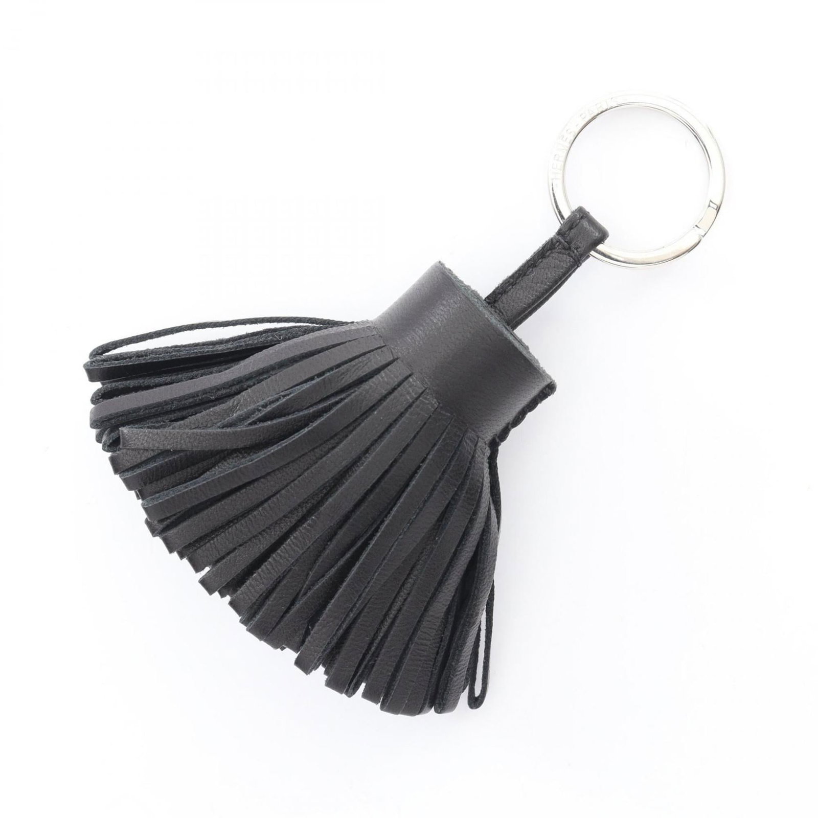Hermes Handbag Charm Agneau Milo: Hermes Handbag Charm Agneau Milo Agneau Milo leather charm from iconic French brand Hermes, bearing subtle signs of use and minor scratches. This black charm showcases the signature style of Hermes,