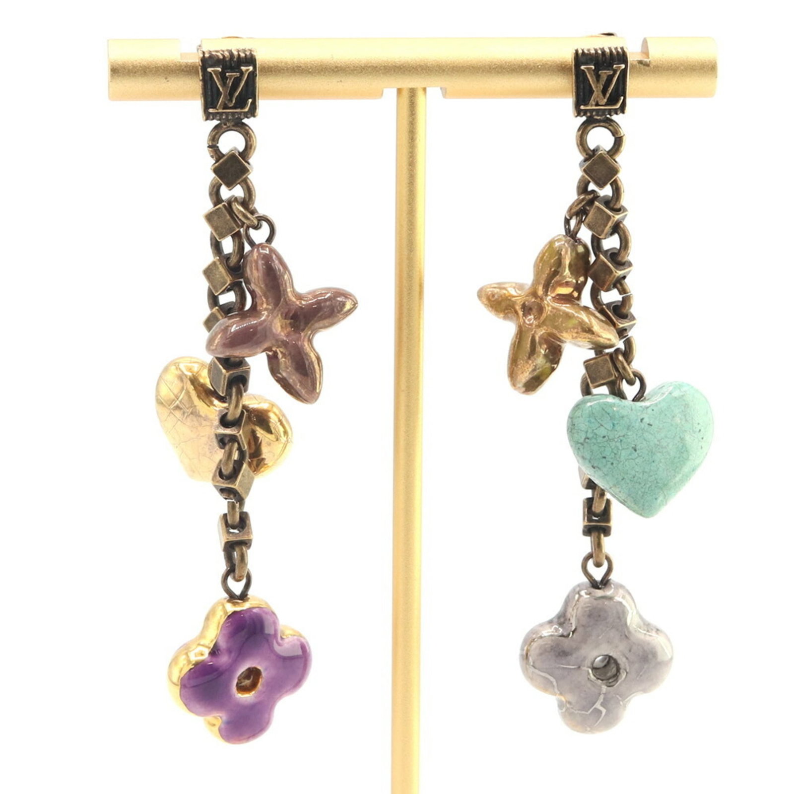 Ceramic Brass Drop Earrings from Louis Vuitton: Ceramic Brass Drop Earrings from Louis Vuitton Brass and ceramic materials come together in these Louis Vuitton drop earrings, bearing the signature of the renowned brand. The used condition reveals