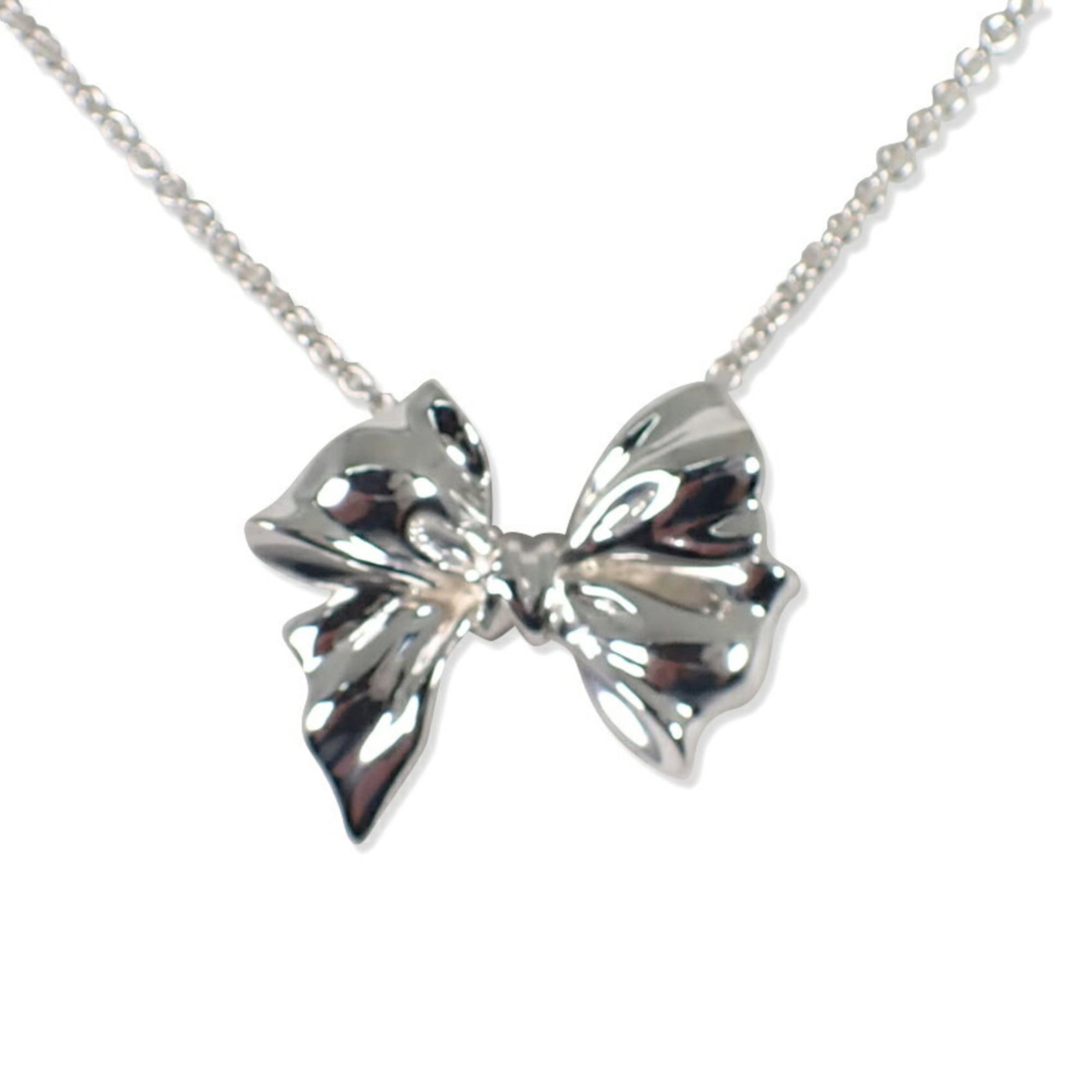 Tiffany & Co. 925 Ribbon Motif Necklace Pendant: Tiffany & Co. 925 Ribbon Motif Necklace Pendant Sterling silver necklace pendant from Tiffany & Co., featuring a beautiful ribbon motif design. The pendant measures 22.6mm x 26.4mm and is set in a