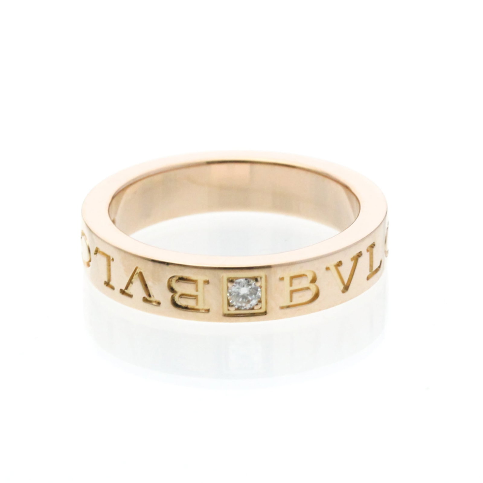 Pink Gold 18K Bvlgari Band Ring: Pink Gold 18K Bvlgari Band Ring Pink Gold 18K Bvlgari Band Ring features a striking pink gold finish, adorned with a diamond stone. The ring's 4.1mm width and 6.6g weight make it a statement piece,