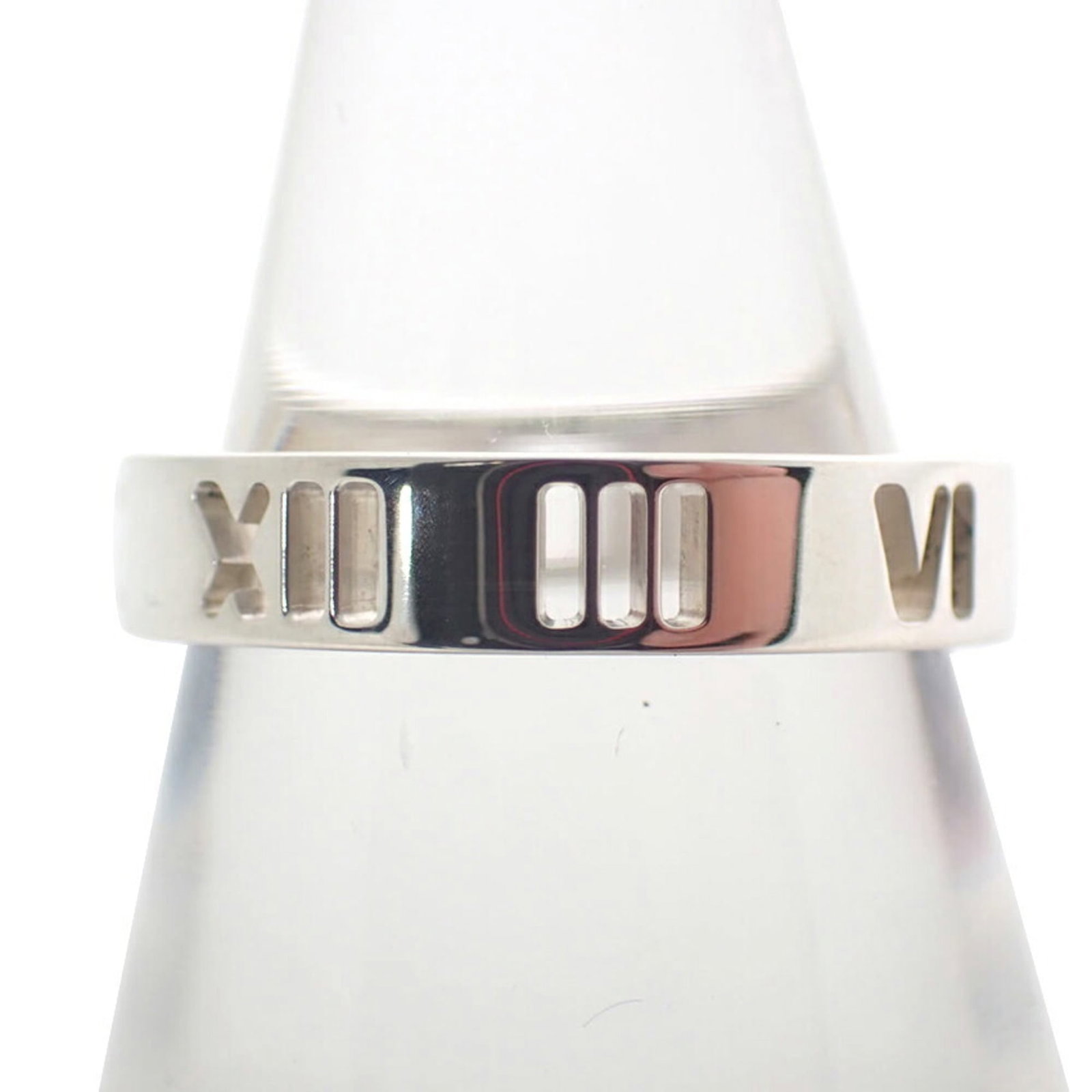 Sterling Silver Ring Tiffany Band: Sterling Silver Ring Tiffany Band Sterling silver band ring from Tiffany, featuring a classic design. The ring bears some signs of usage, including minor scratches and dirt, but remains in very good