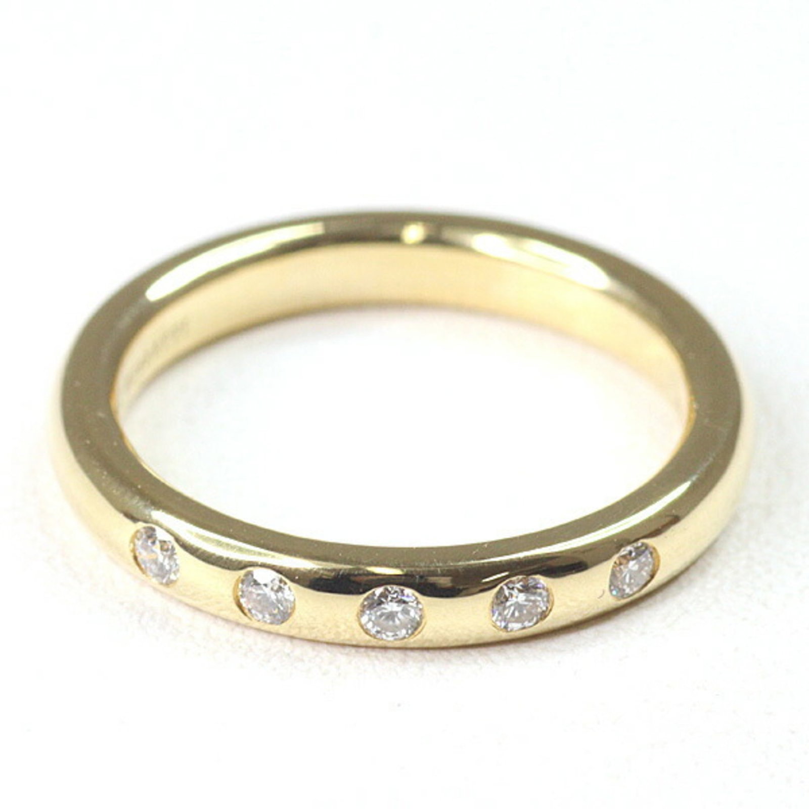 Tiffany Ring Gold Yellow 18K: Tiffany Ring Gold Yellow 18K Yellow Gold Band Ring with Diamond. A Tiffany Type band ring in 18K yellow gold, featuring a diamond stone, available in size 4.5 and width 2.7mm. Used condition with some
