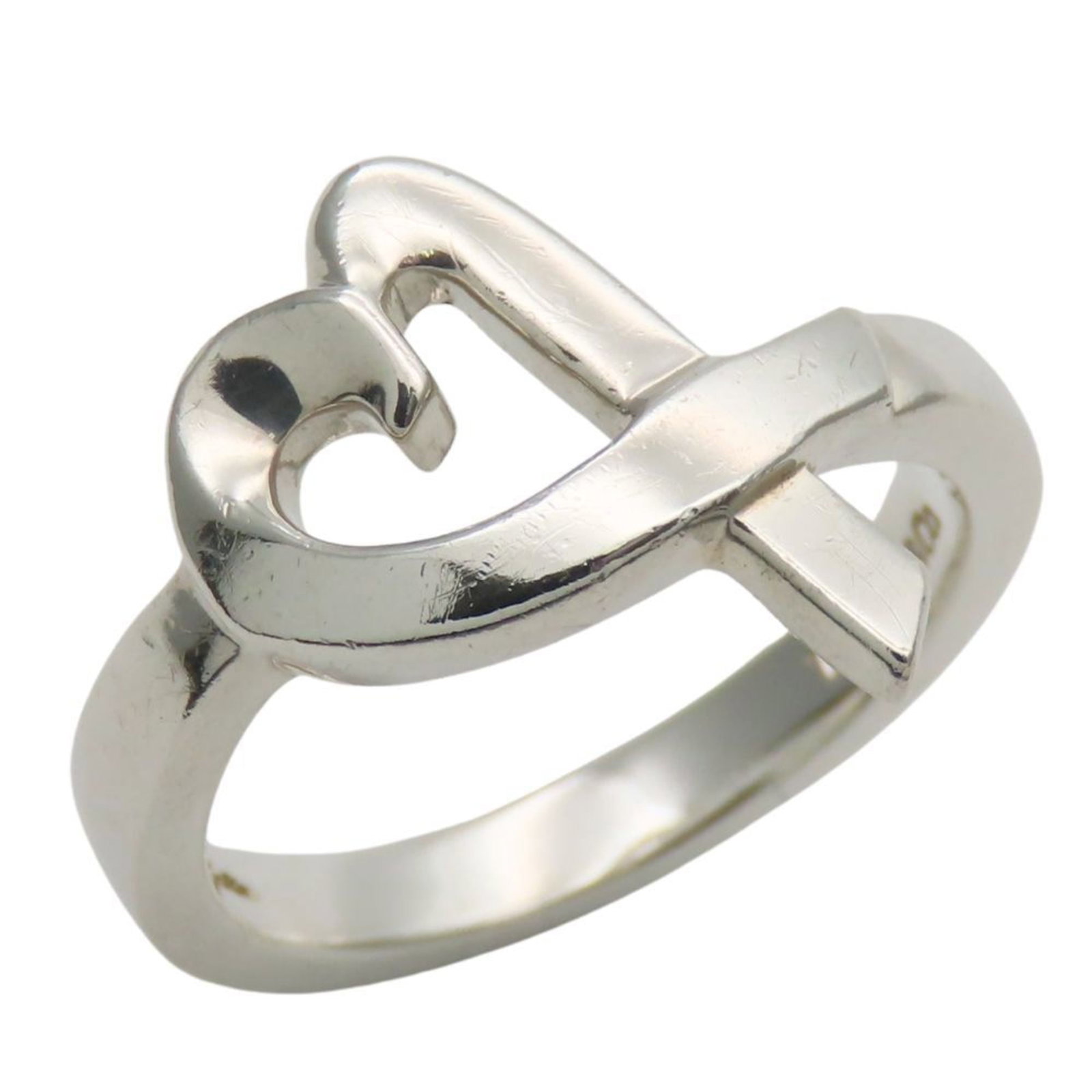 Tiffany Band Ring Silver 925: Tiffany Band Ring Silver 925 Silver band ring from Tiffany, made with high-quality silver 925 material. The ring features a classic design and bears a signature, adding a touch of elegance to any