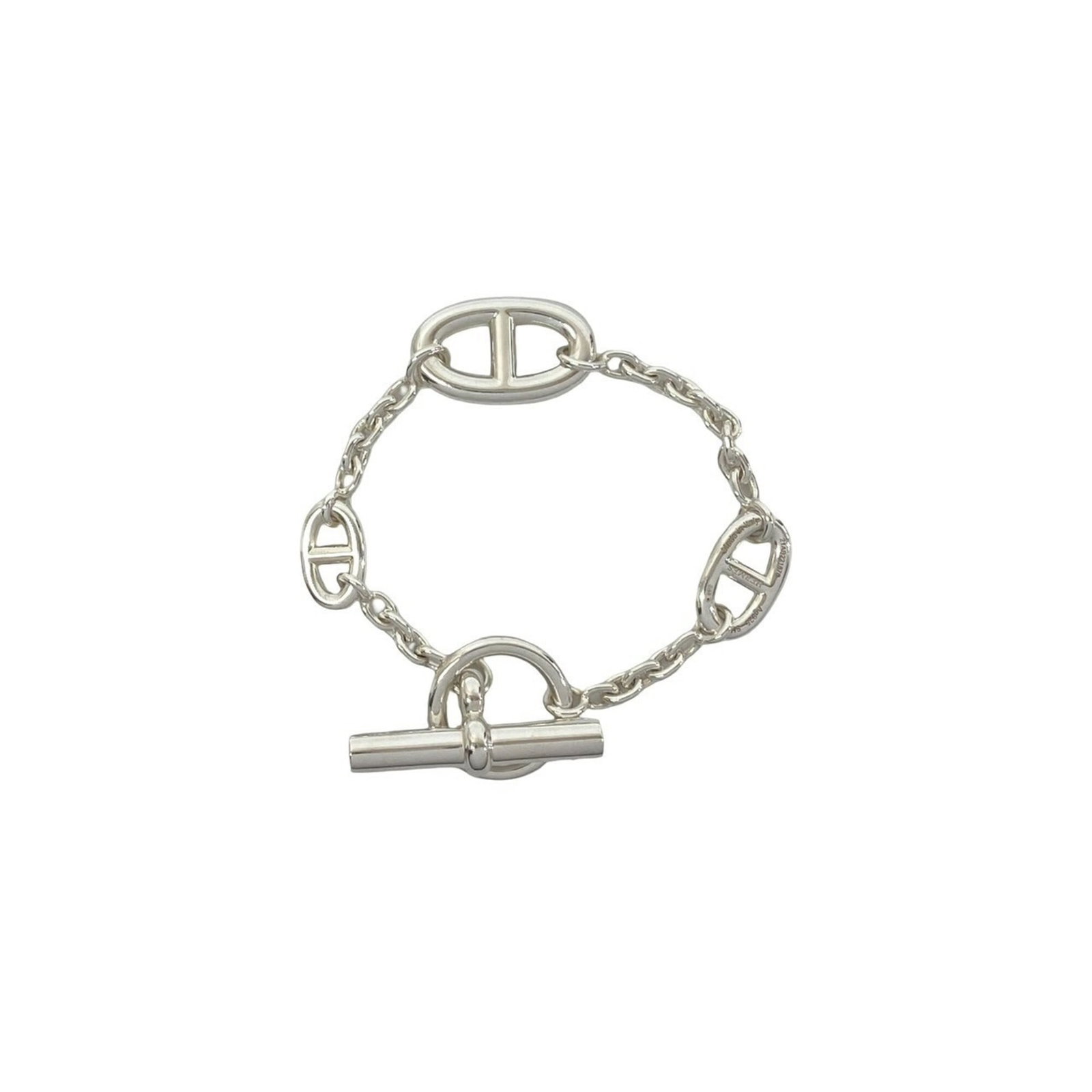 Silver Charm Bracelet 925 by Hermes: Silver Charm Bracelet 925 by Hermes Silver Charm Bracelet 925 by Hermes features a delicate, silver charm bracelet with a subtle sheen. The 17.5cm length offers a versatile fit for everyday wear,